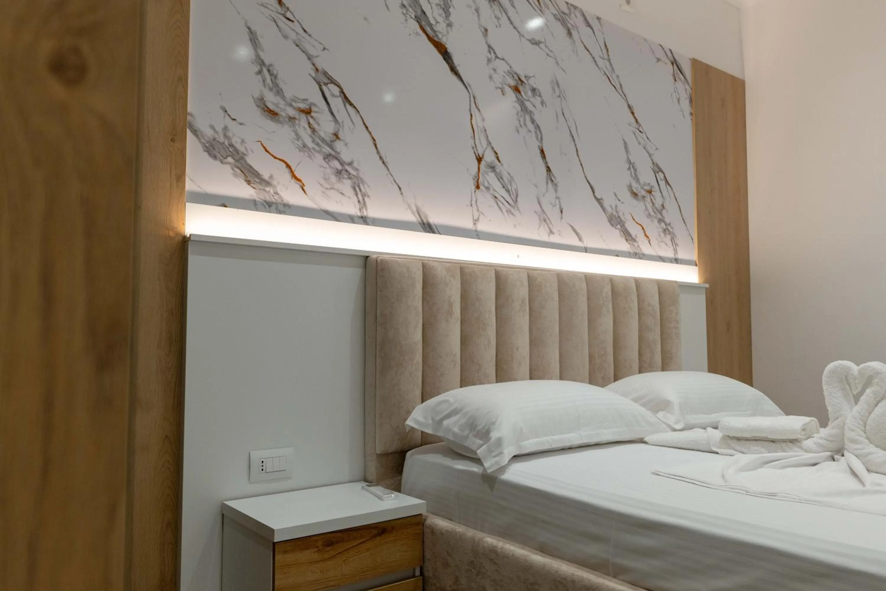 Bed in Regal Luxury Apartments