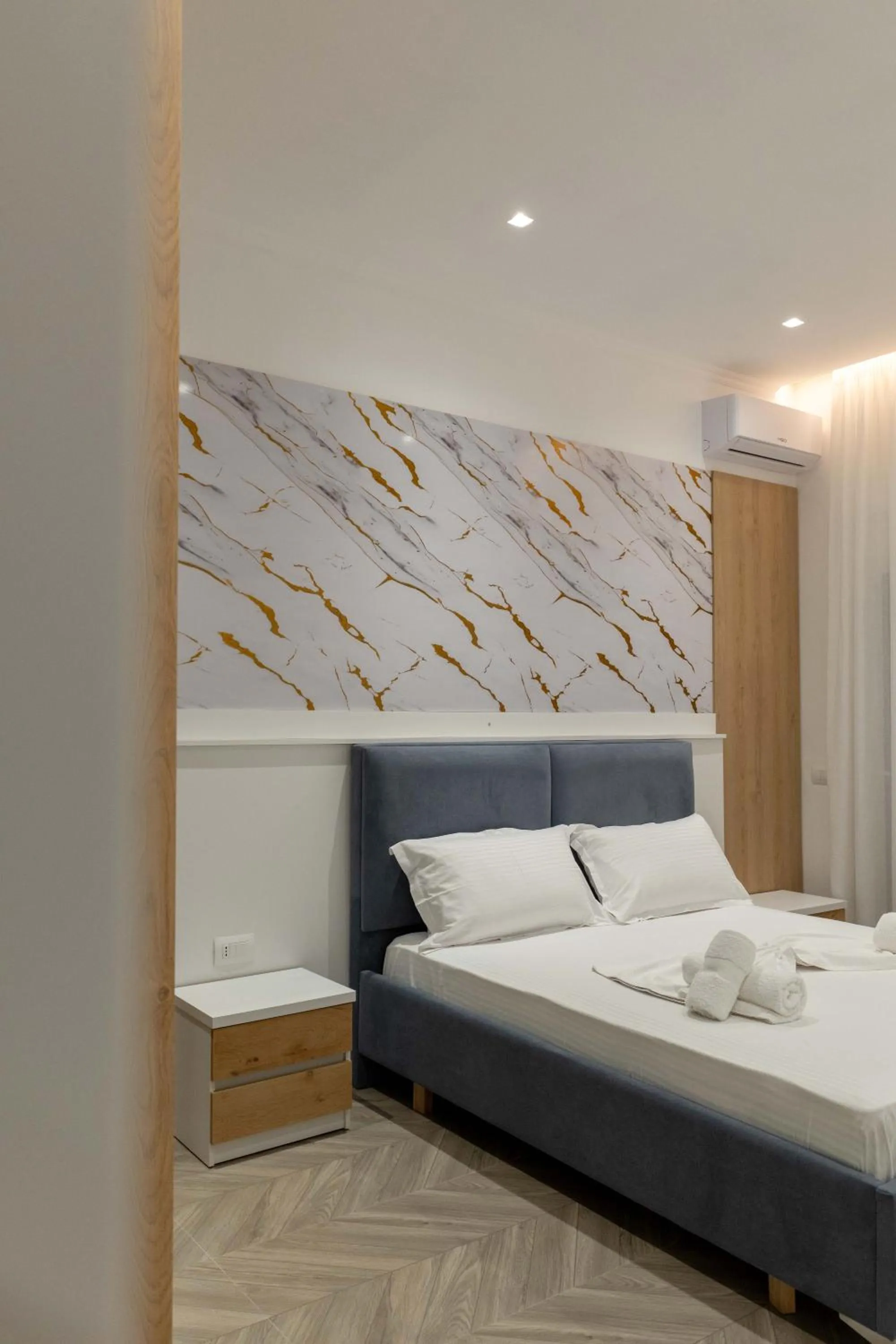 Bed in Regal Luxury Apartments