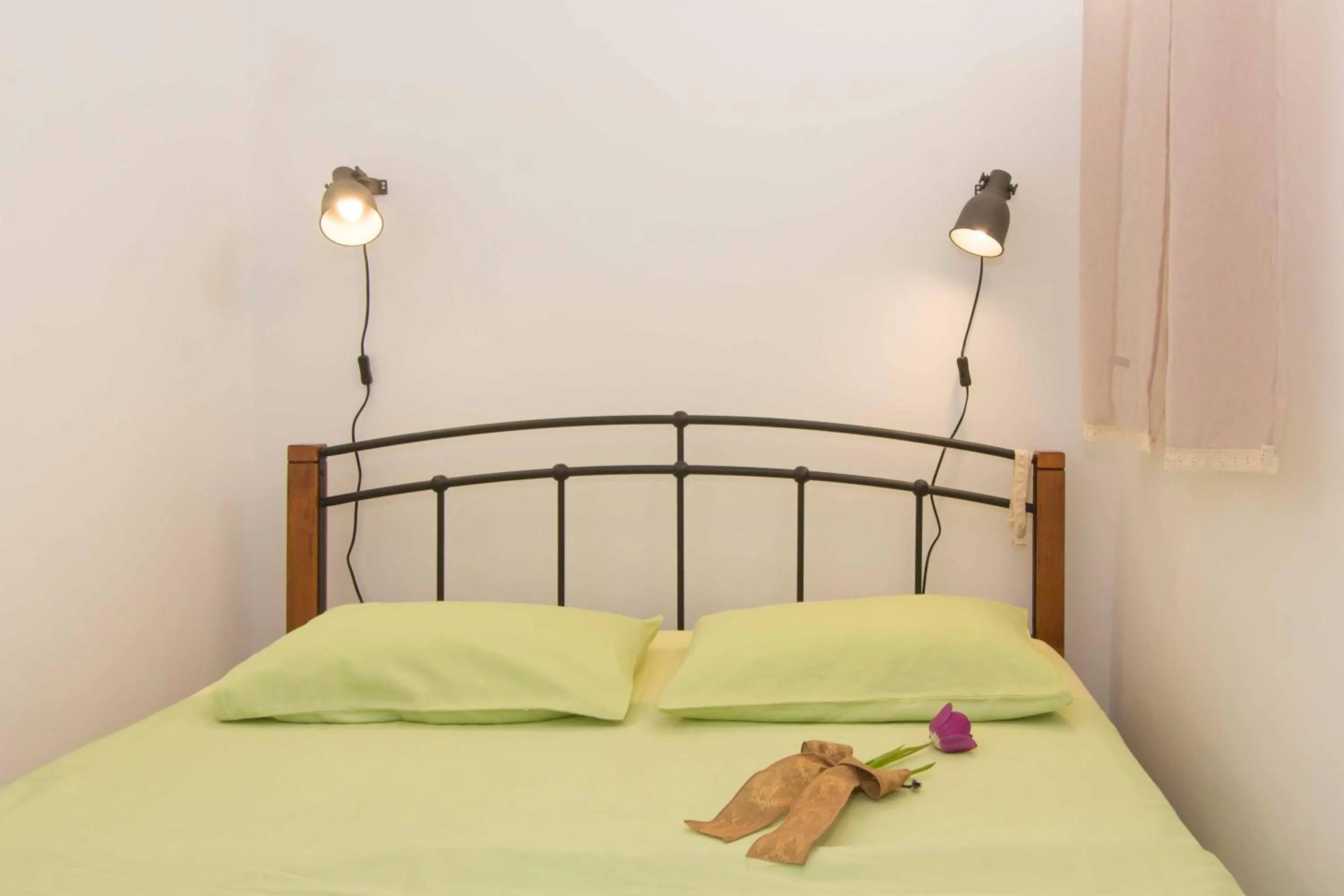 Bed in Red Valentino Apartment