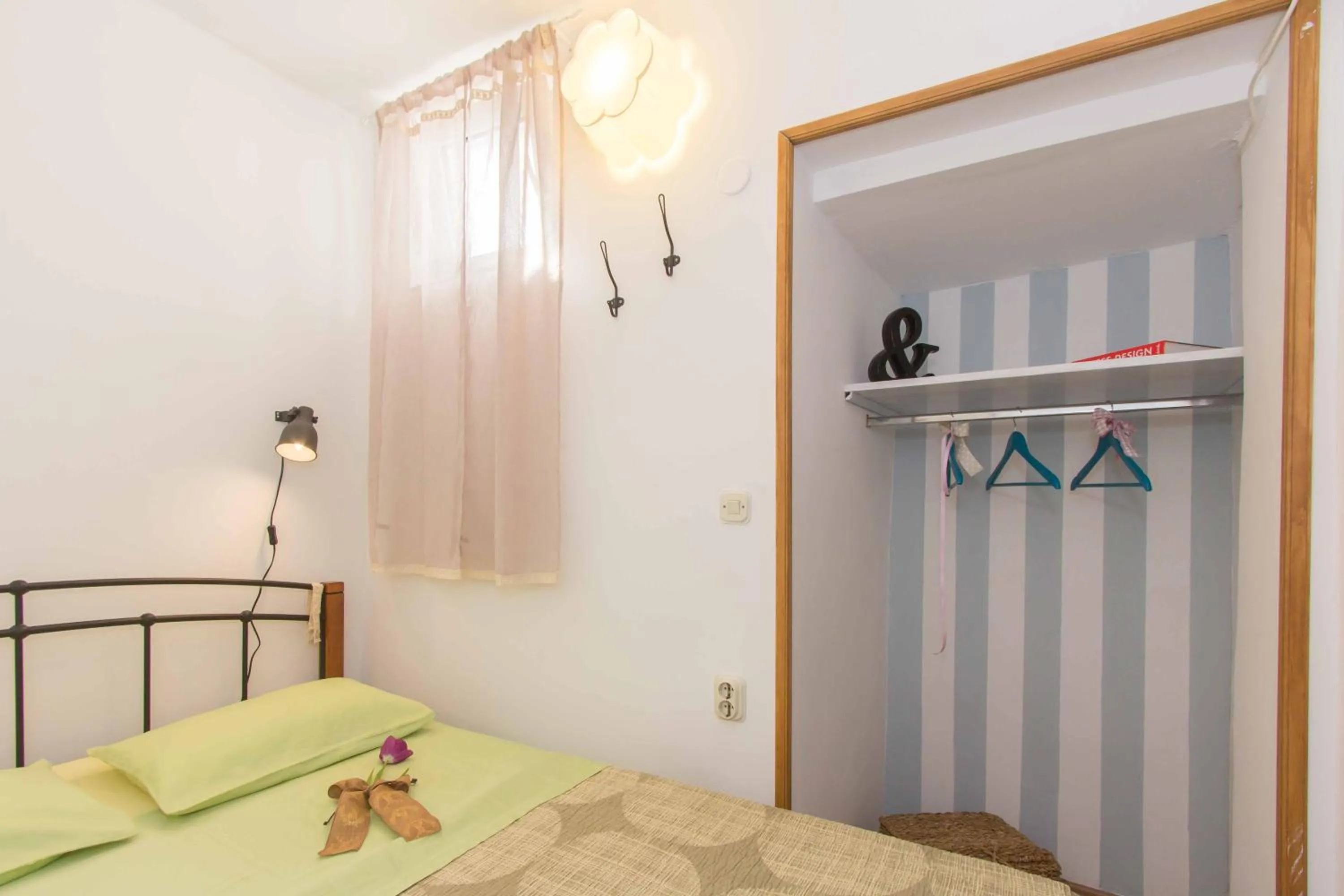 Bed in Red Valentino Apartment