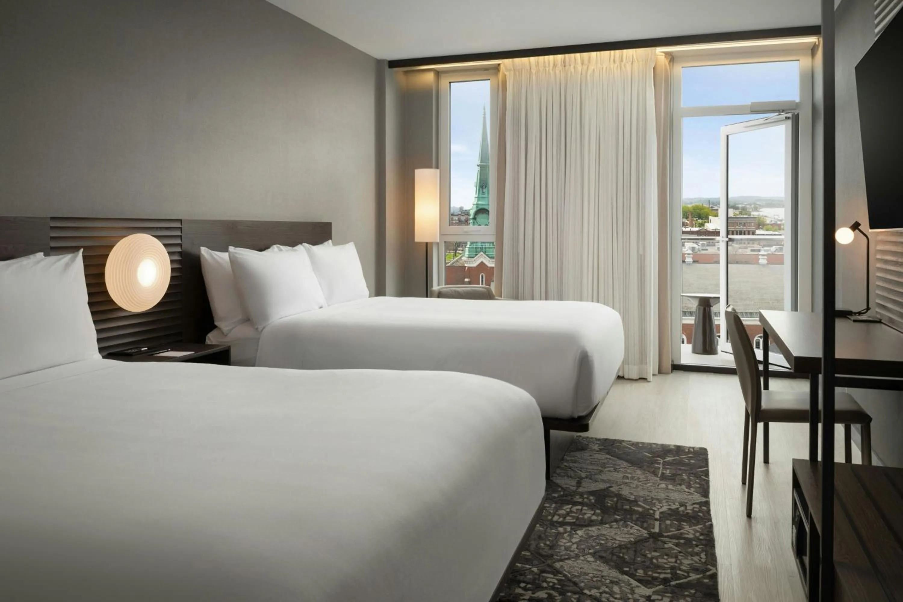 Photo of the whole room, Bed in AC Hotel by Marriott Burlington