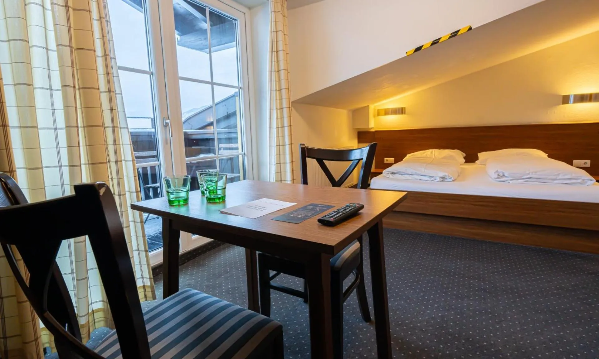 Bedroom, Bed in Hotel Pinzgauerhof by Alpeffect Hotels