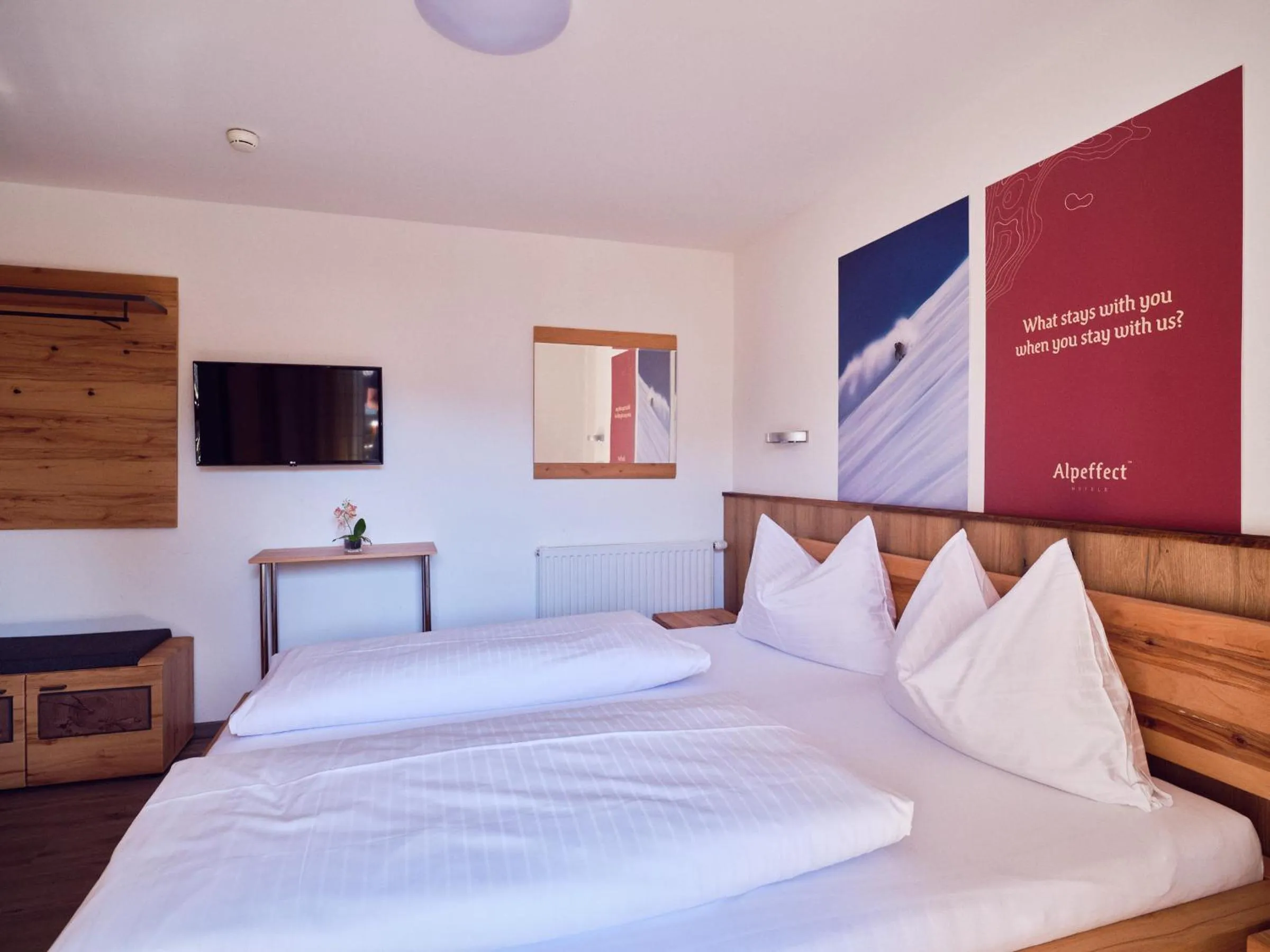 Bedroom, Bed in Hotel Pinzgauerhof by Alpeffect Hotels