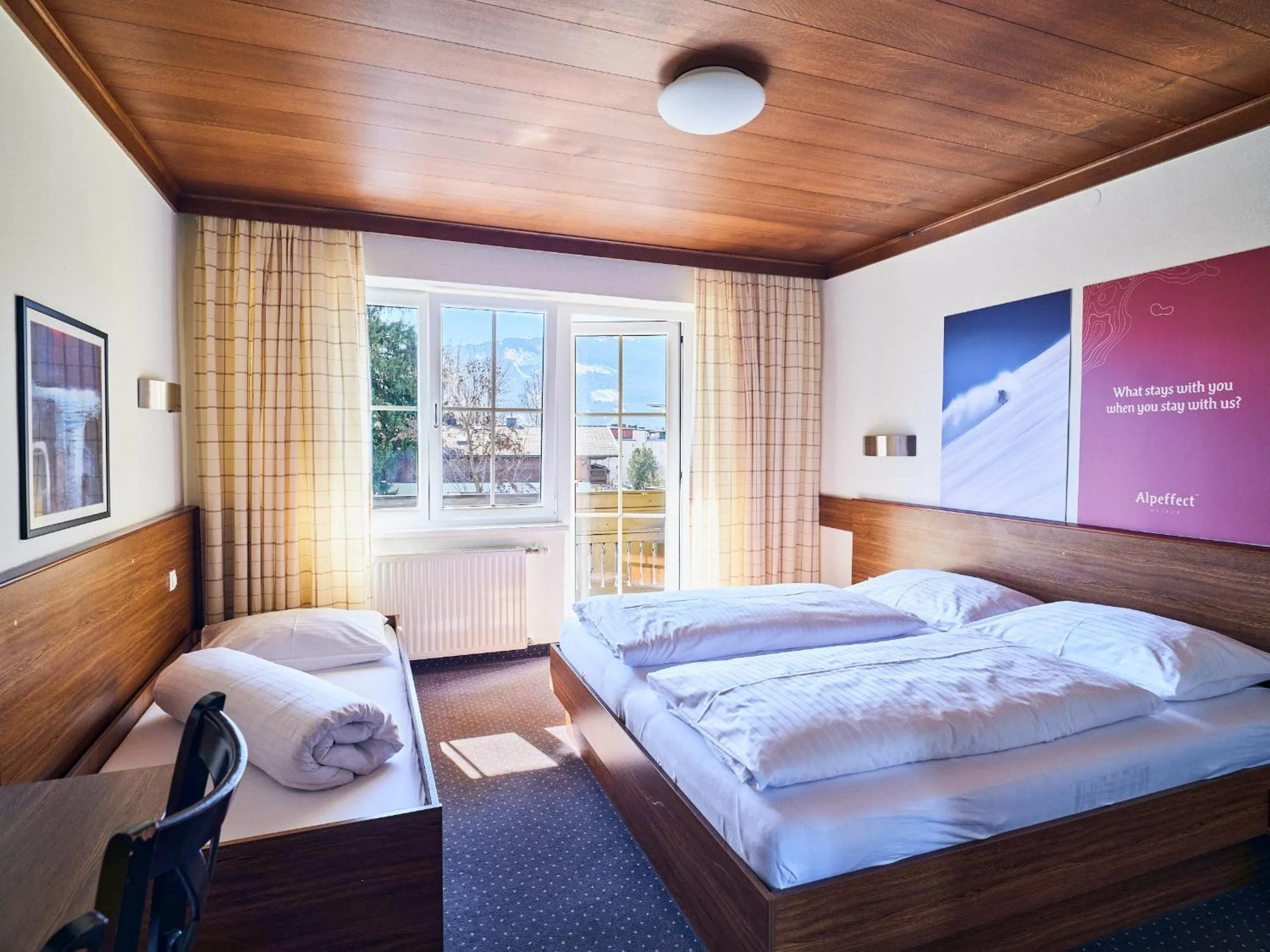 Bed in Hotel Pinzgauerhof by Alpeffect Hotels