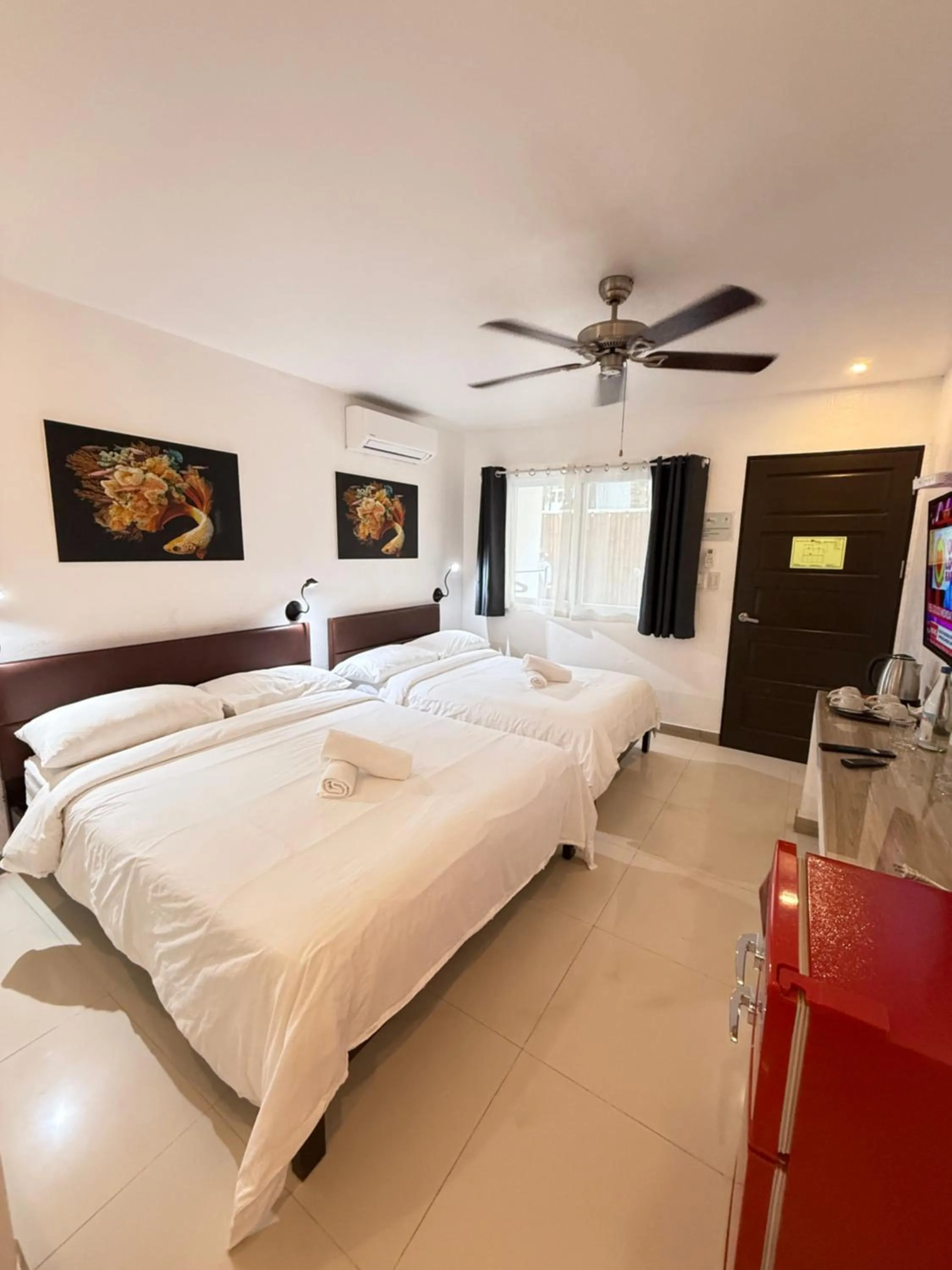 Photo of the whole room, Bed in Calypso Beach and Dive Resort