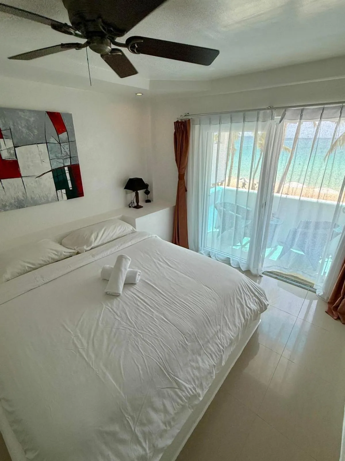 Bed in Calypso Beach and Dive Resort