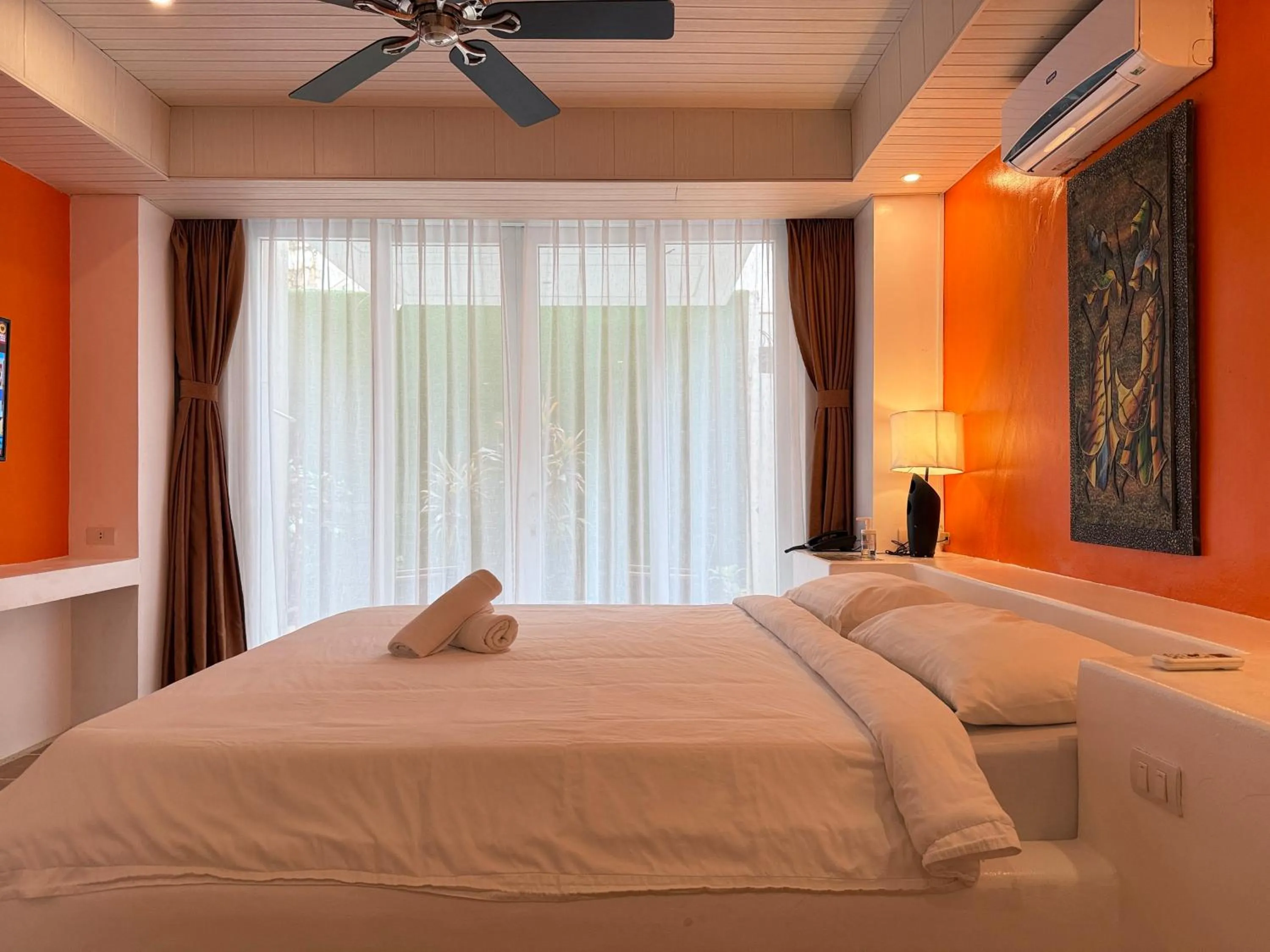 Bed in Calypso Beach and Dive Resort