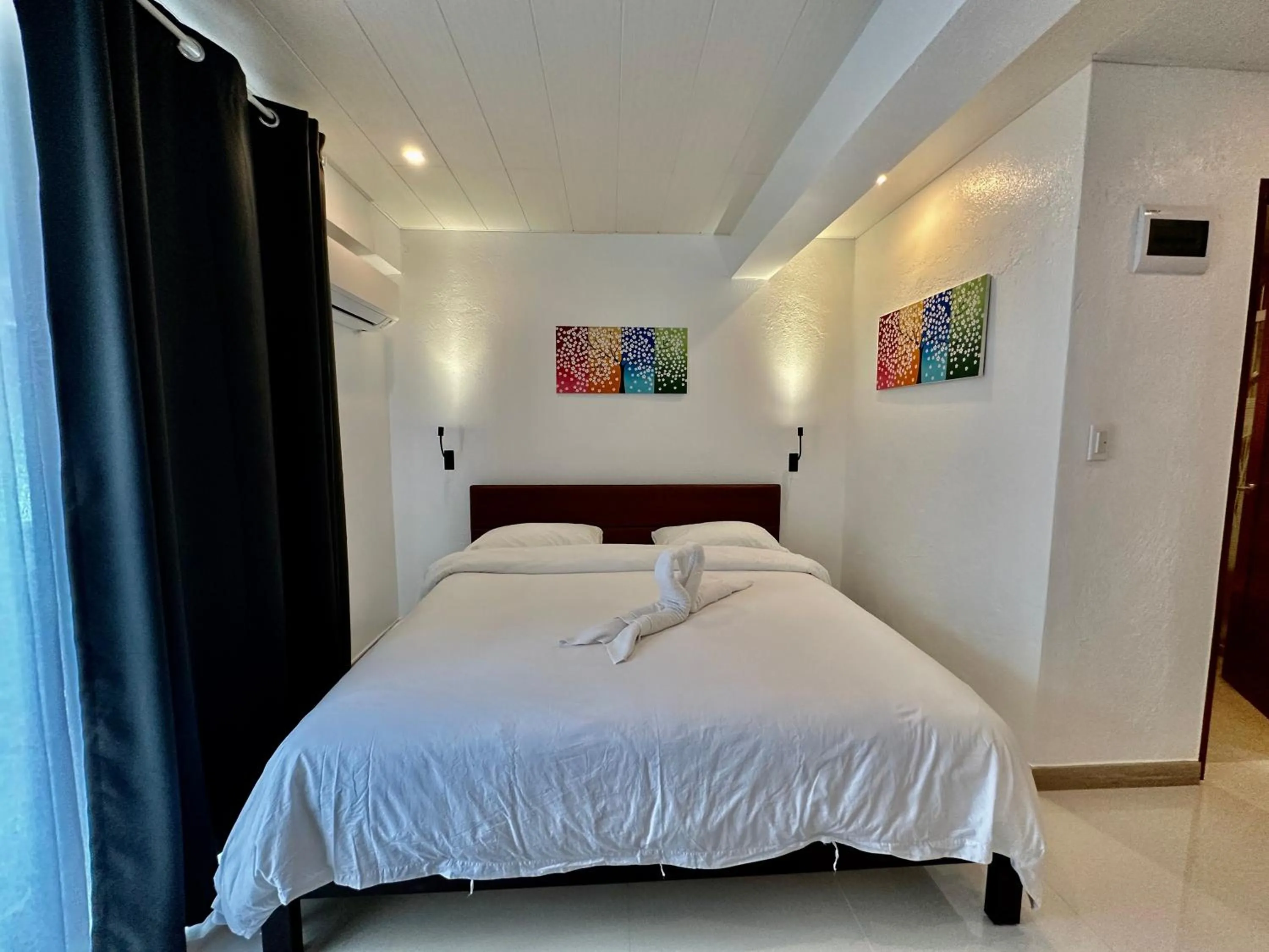Bed in Calypso Beach and Dive Resort