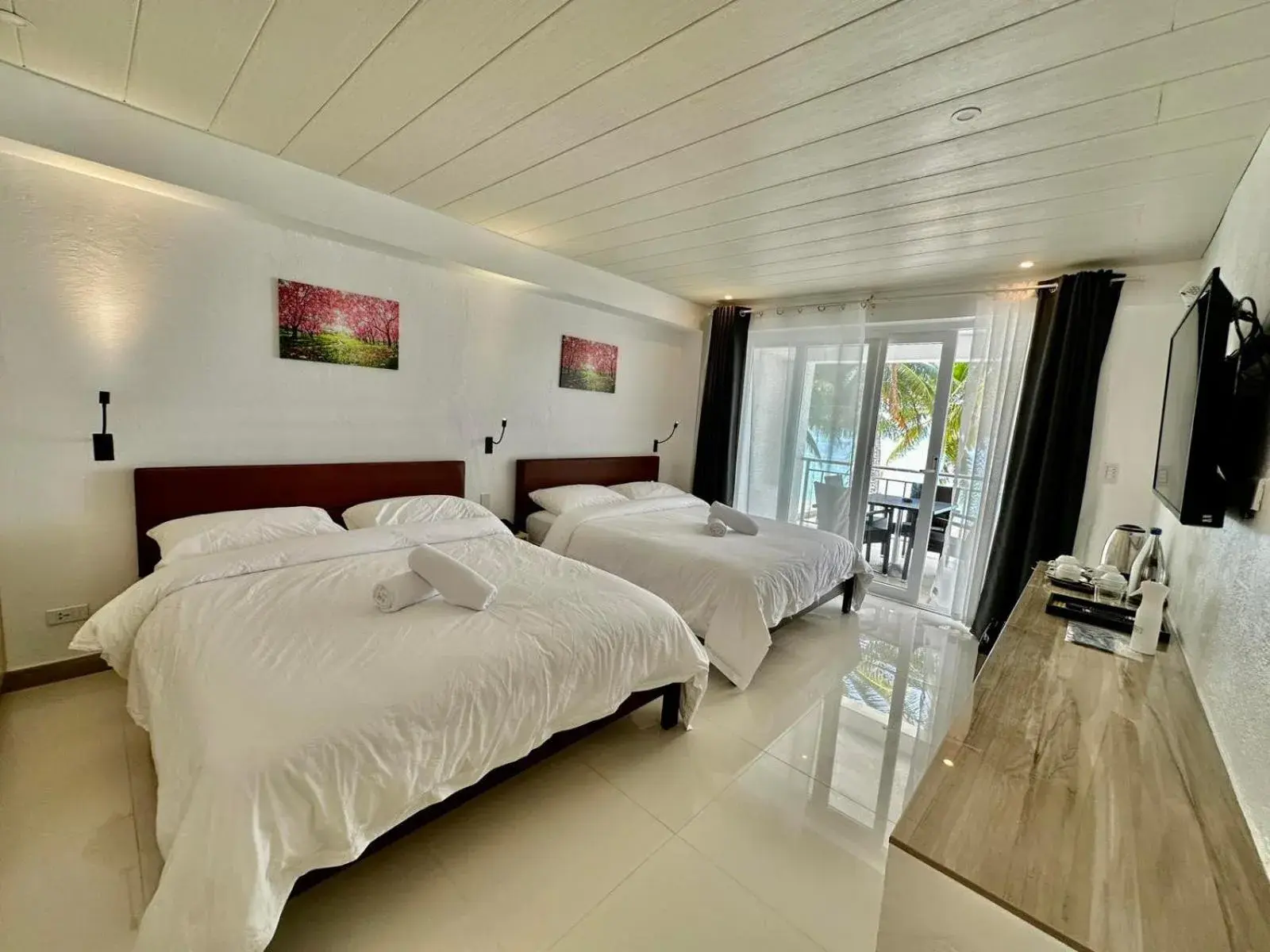 Bed in Calypso Beach and Dive Resort Bed in Calypso Beach and Dive Resort