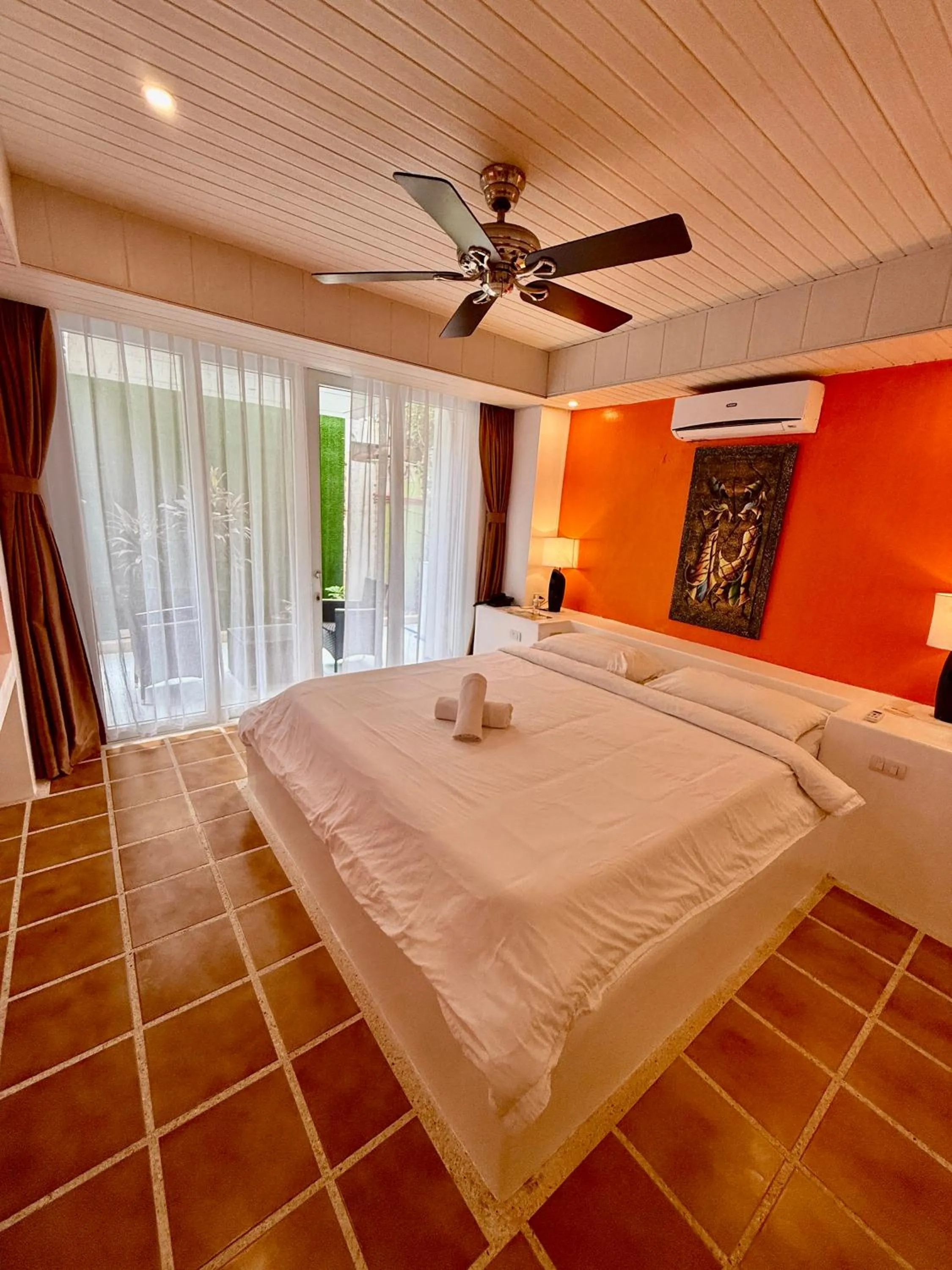 Photo of the whole room, Bed in Calypso Beach and Dive Resort