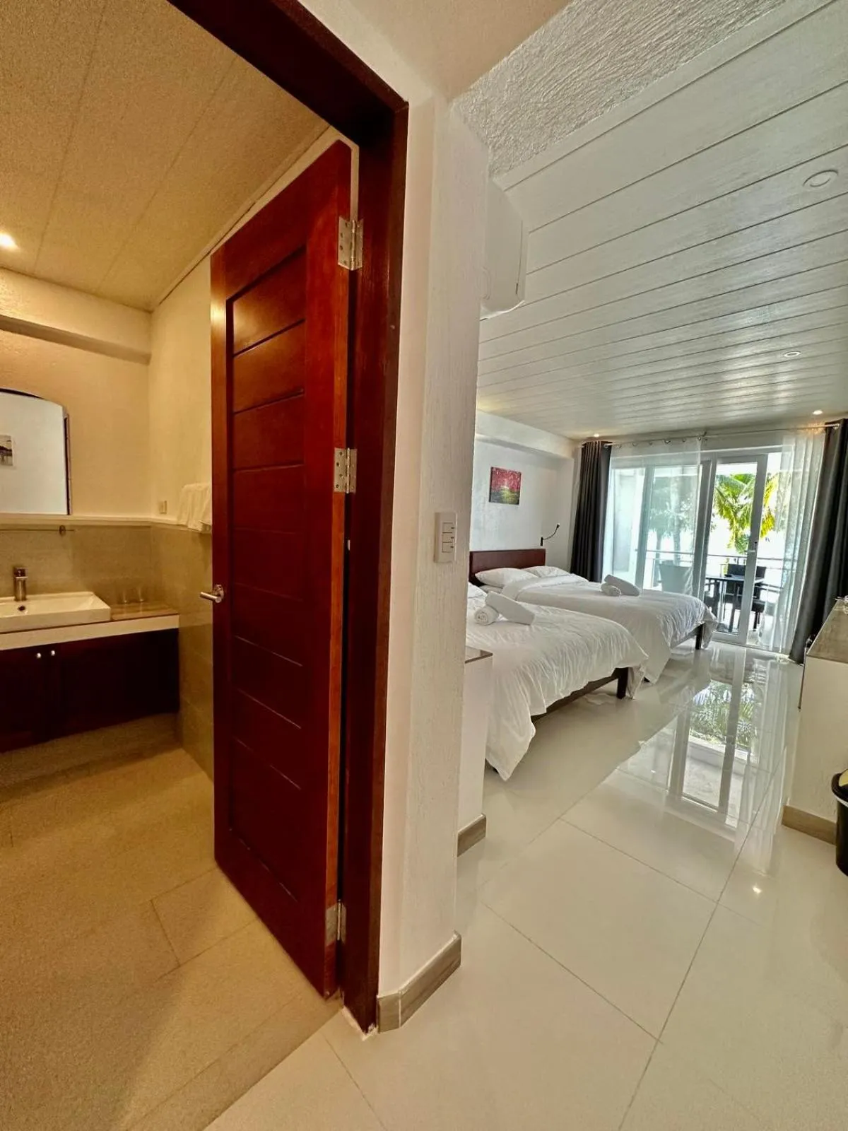 Bed in Calypso Beach and Dive Resort