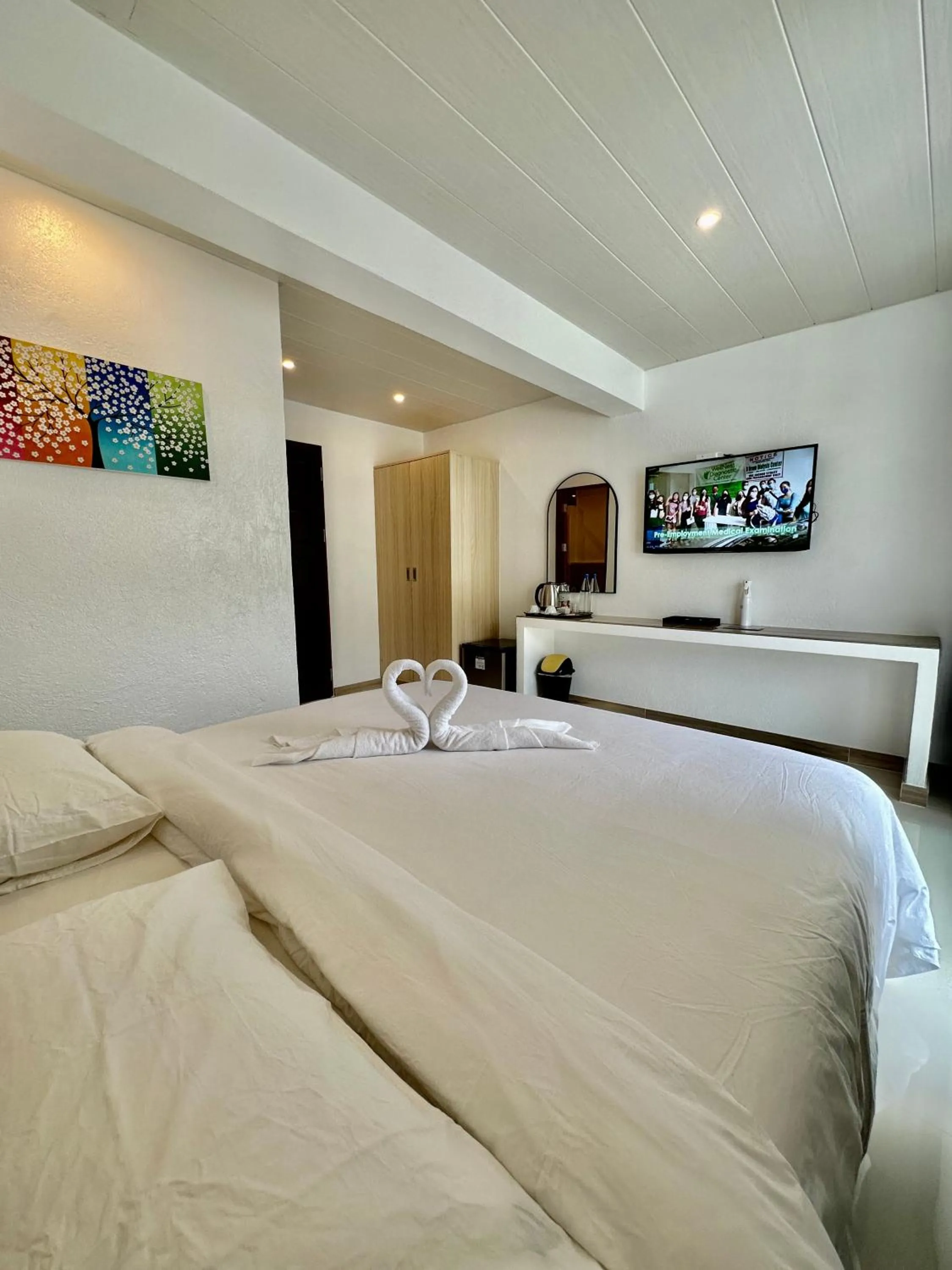 Photo of the whole room, Bed in Calypso Beach and Dive Resort