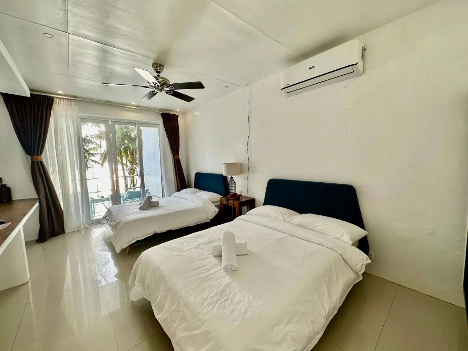Bed in Calypso Beach and Dive Resort