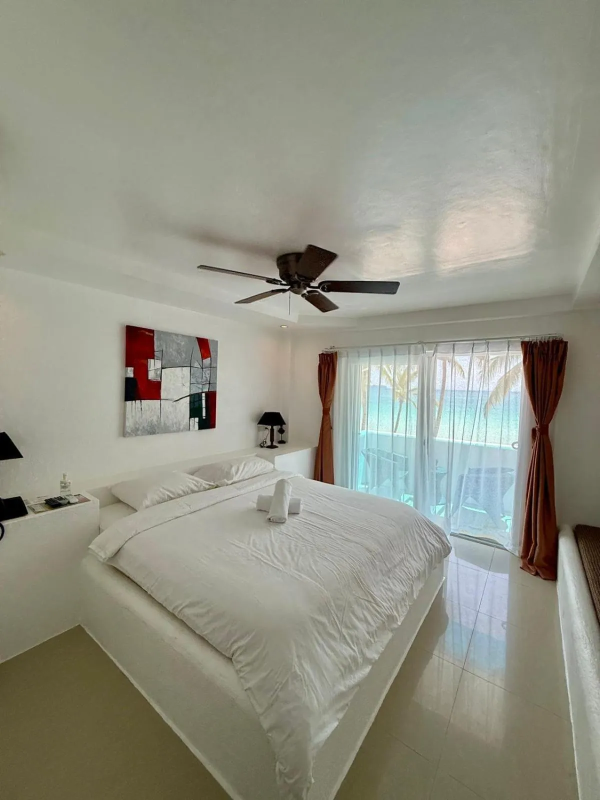 Bed in Calypso Beach and Dive Resort