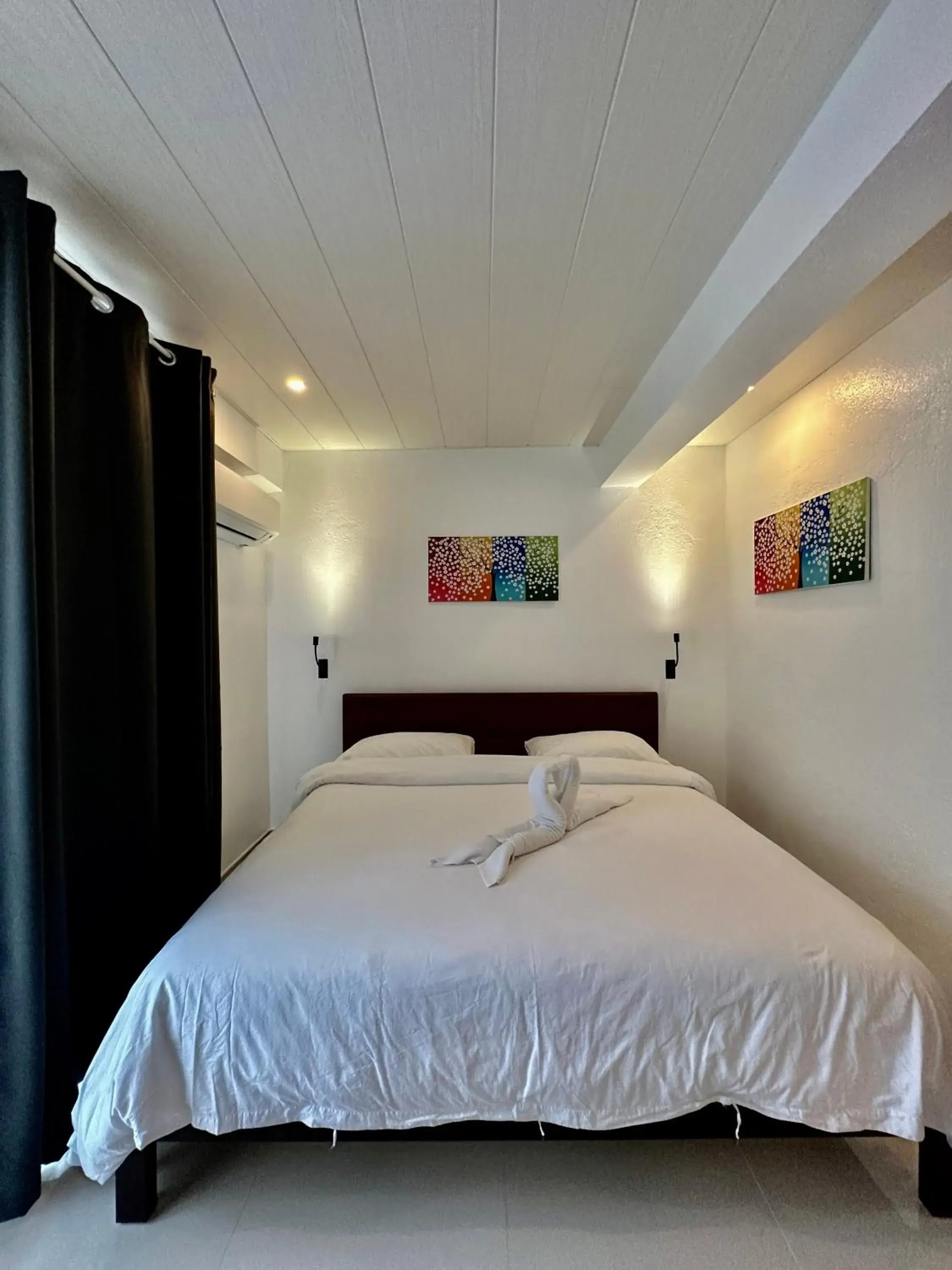 Bed in Calypso Beach and Dive Resort Bed in Calypso Beach and Dive Resort