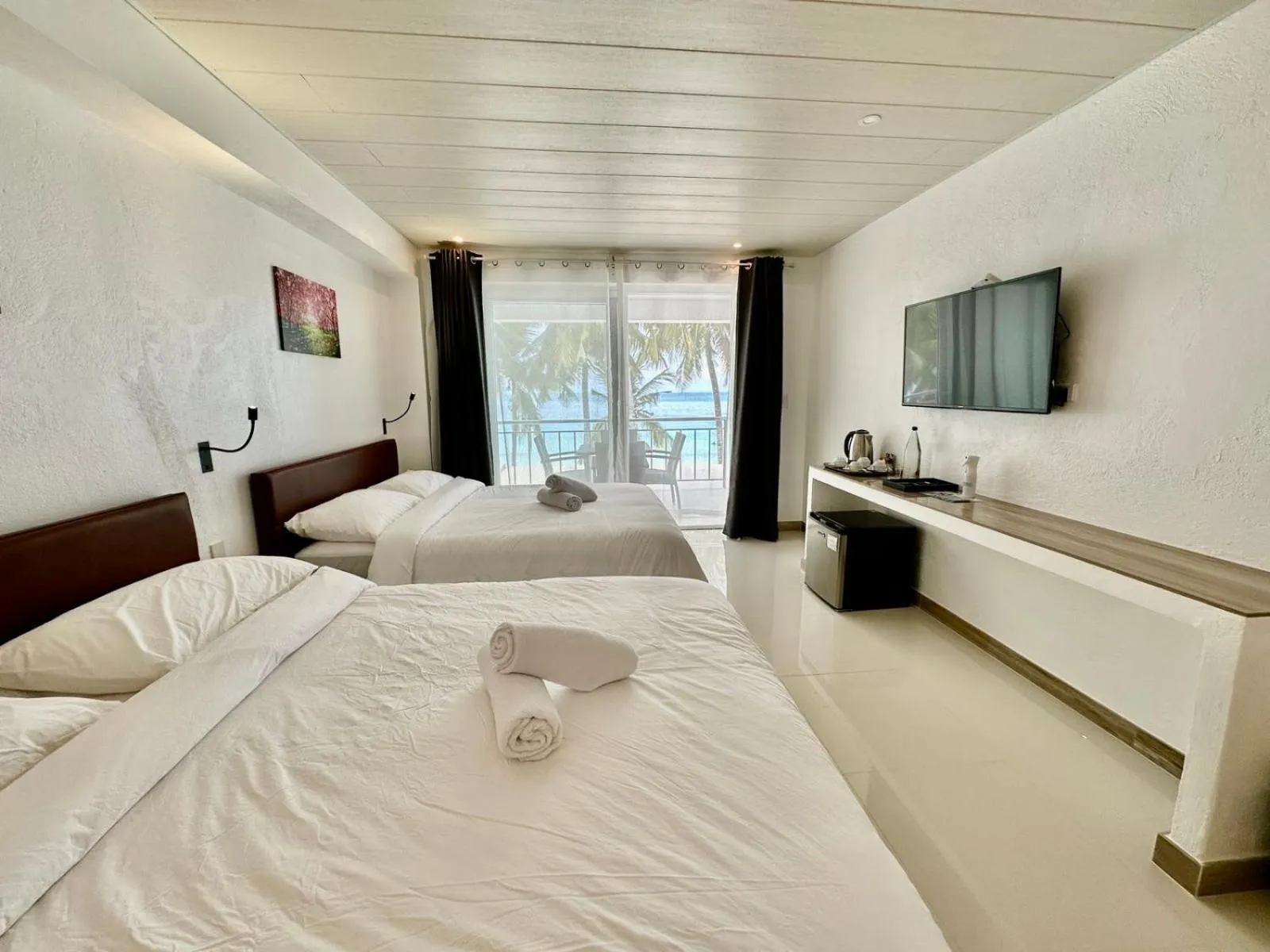 Bed in Calypso Beach and Dive Resort