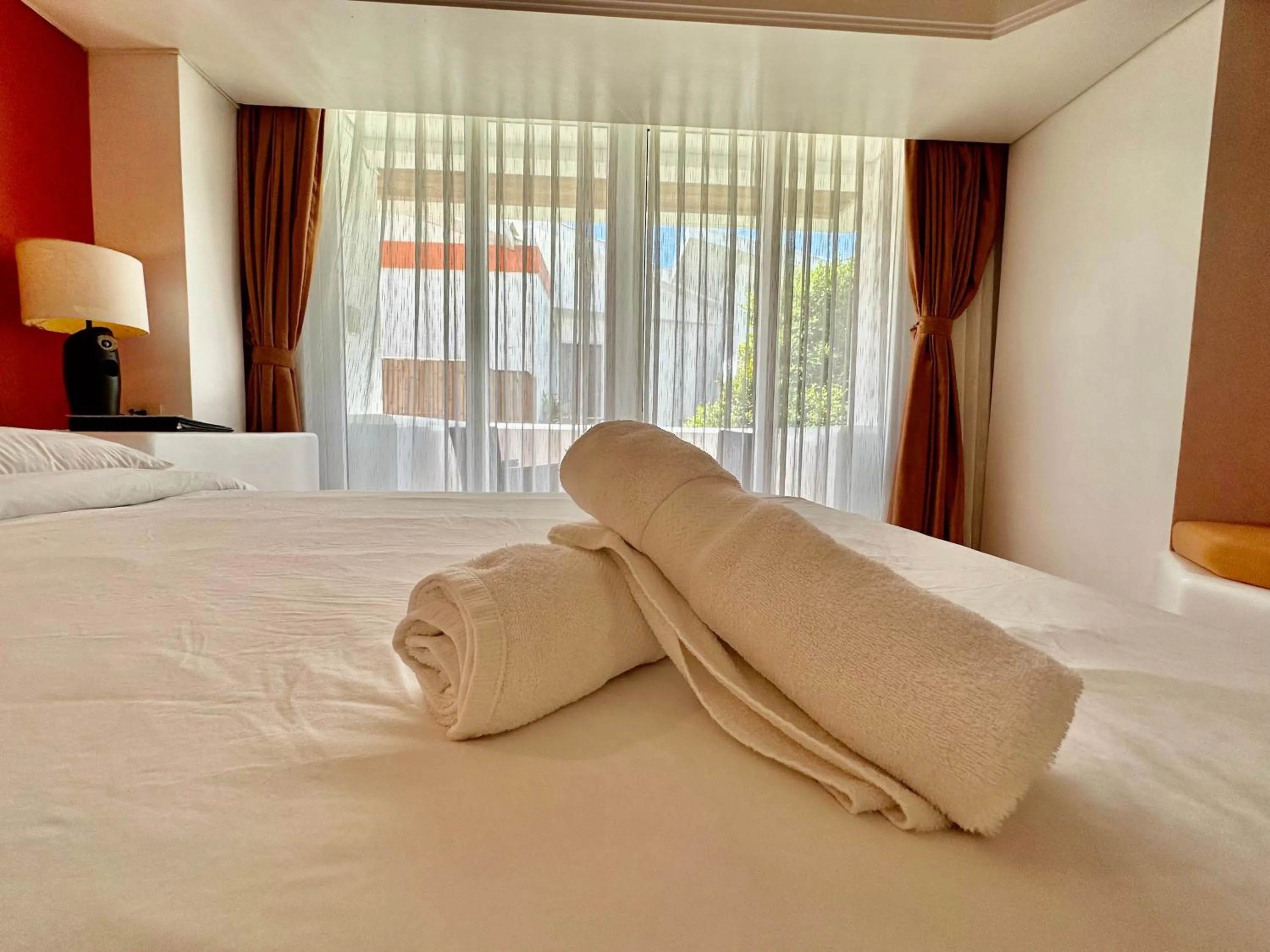 towels, Bed in Calypso Beach and Dive Resort