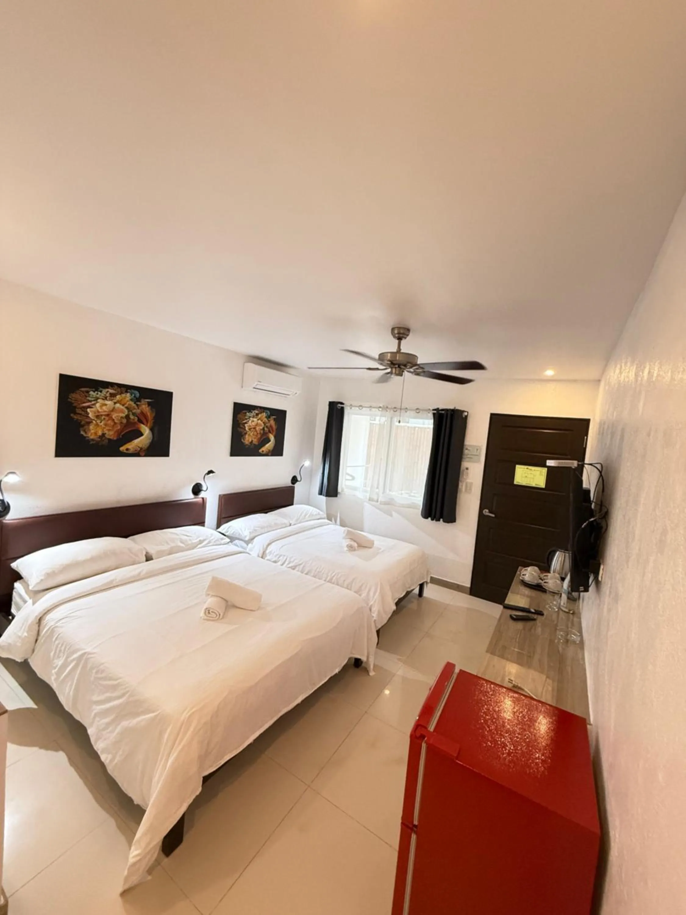 Photo of the whole room, Bed in Calypso Beach and Dive Resort