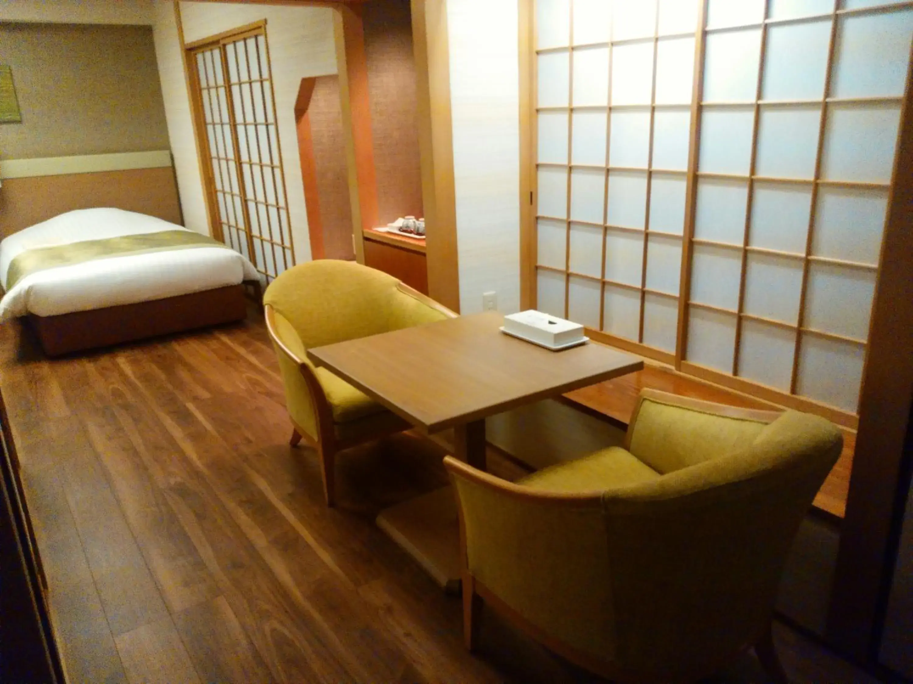 Seating area, Bed in JR Hotel Clement Tokushima Seating area, Bed in JR Hotel Clement Tokushima