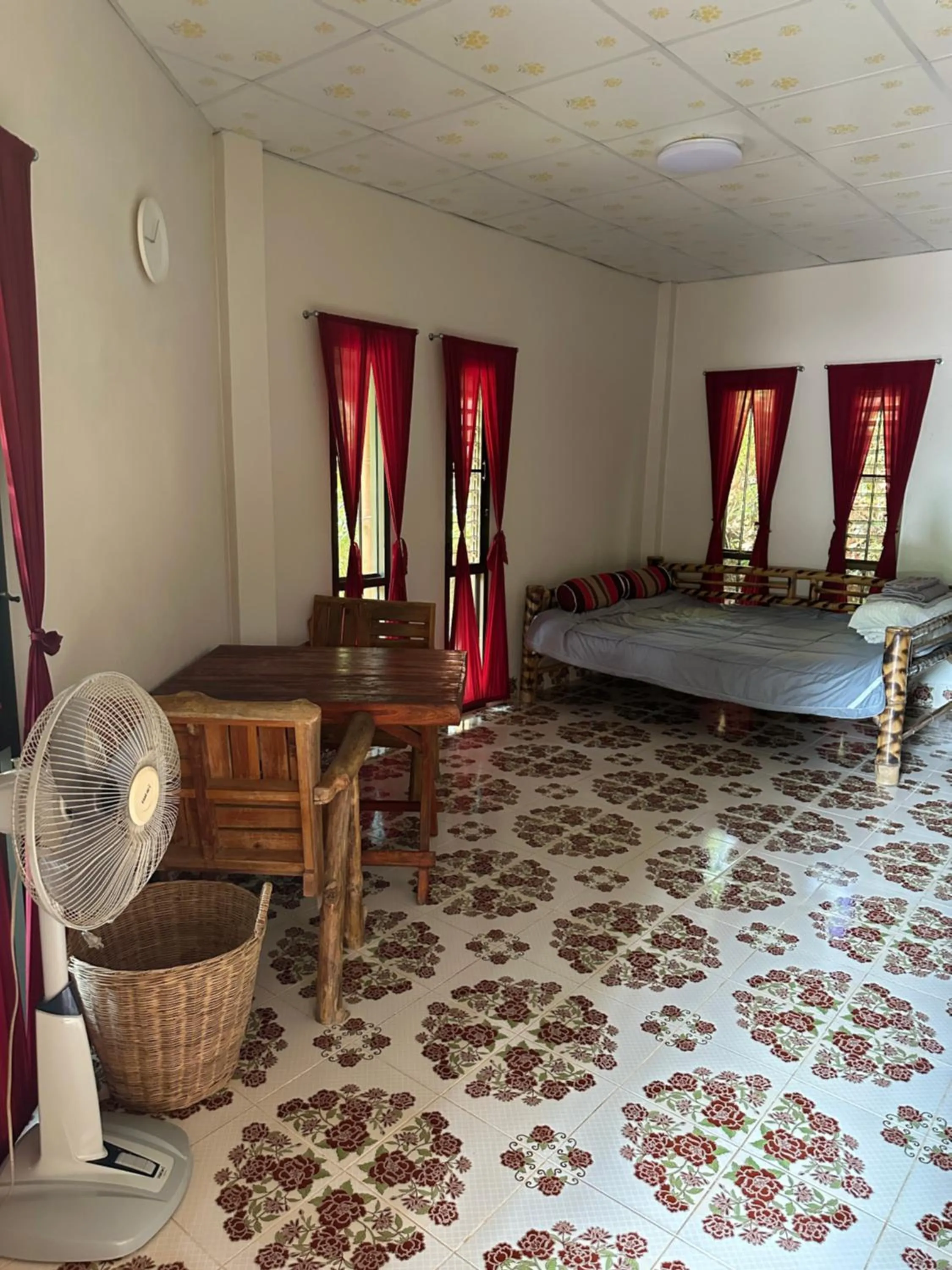 Seating area, Bed in Fine Times Resort