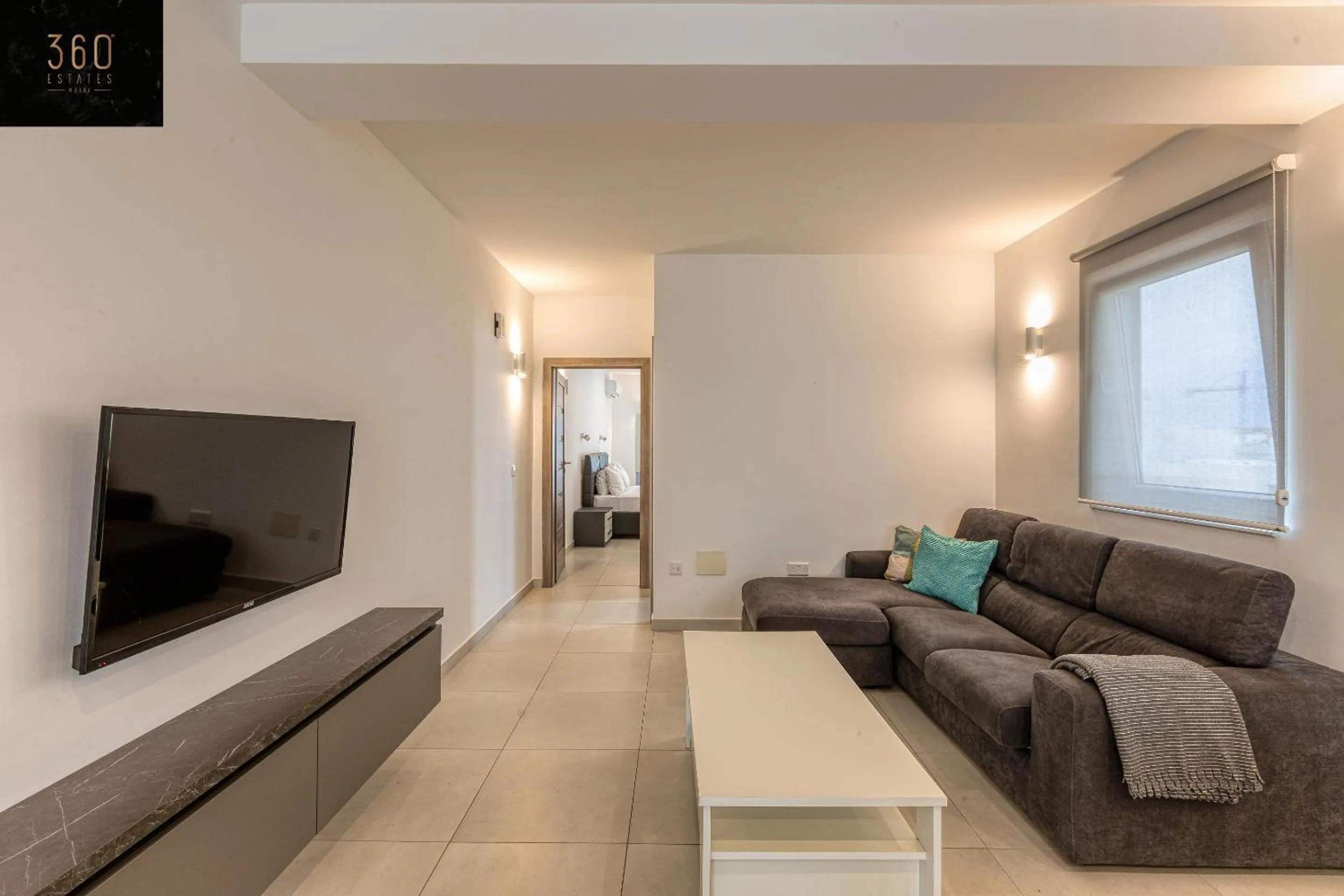 Communal lounge/ TV room in Stunning 2BR penthouse with harbour view & BBQ by 360 Estates
