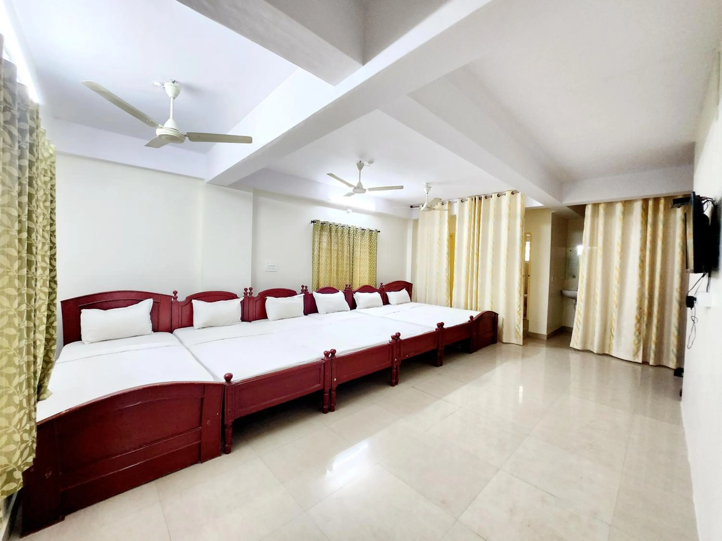 Photo of the whole room, Bed in Suvarna Residency