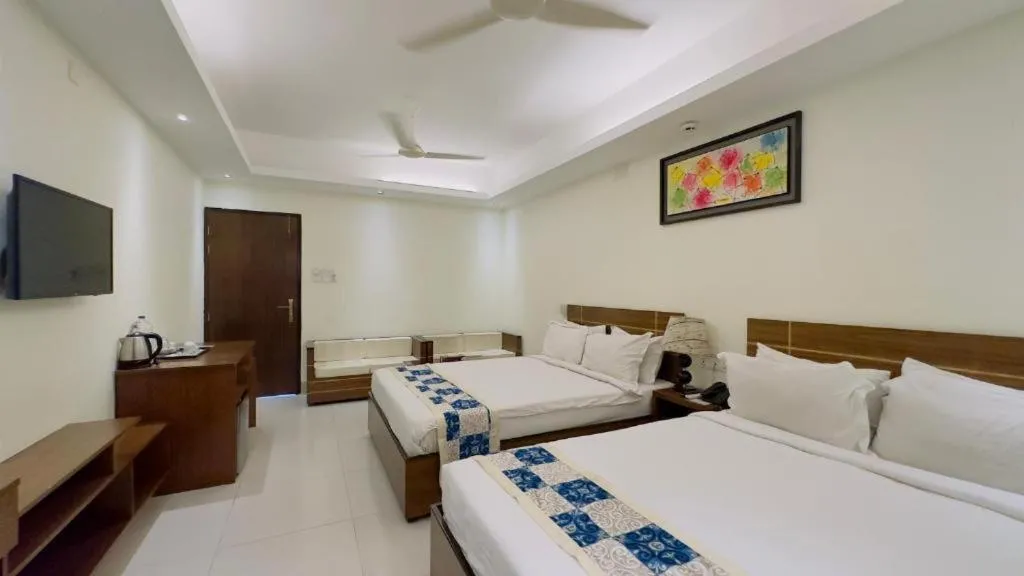 Bed in Royal Living Hotel & Suites