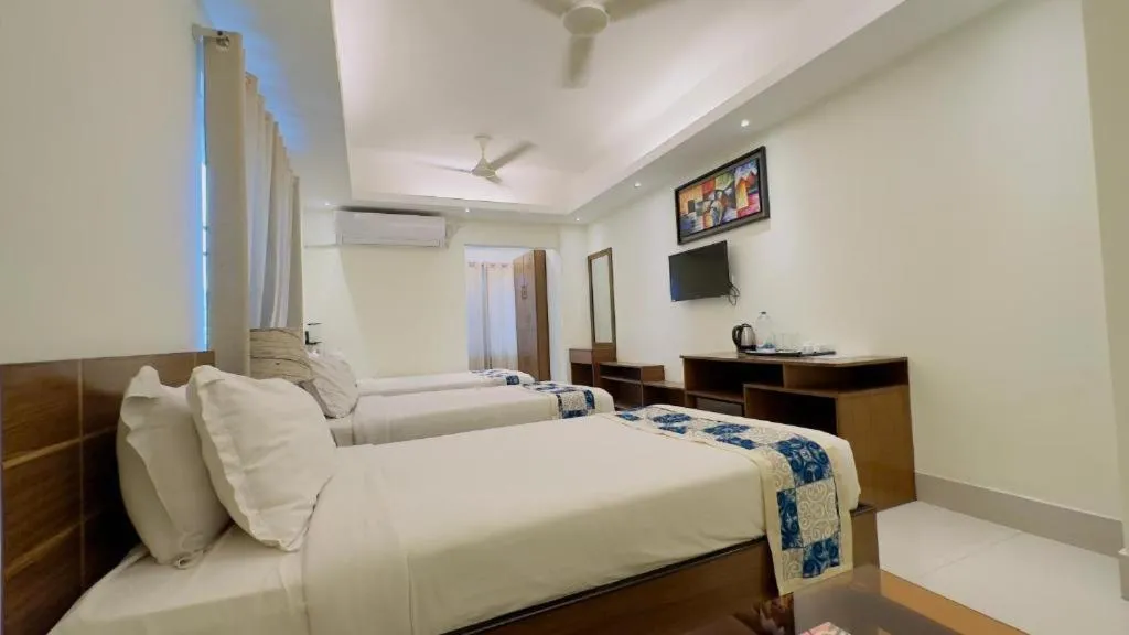 Bed in Royal Living Hotel & Suites
