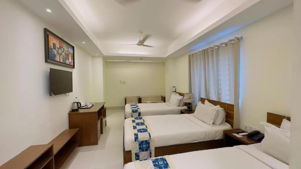 Bed in Royal Living Hotel & Suites