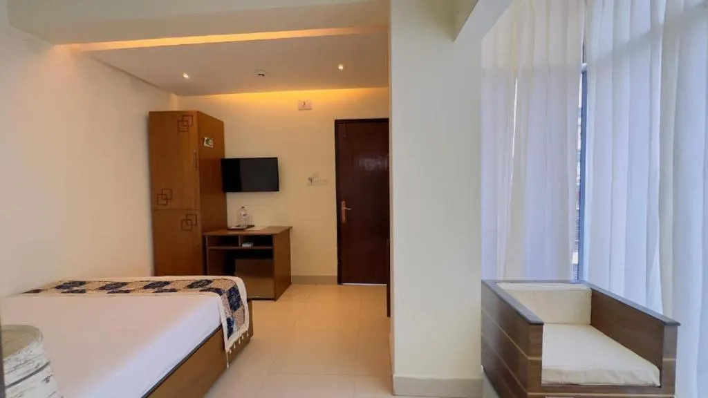 Bed in Royal Living Hotel & Suites
