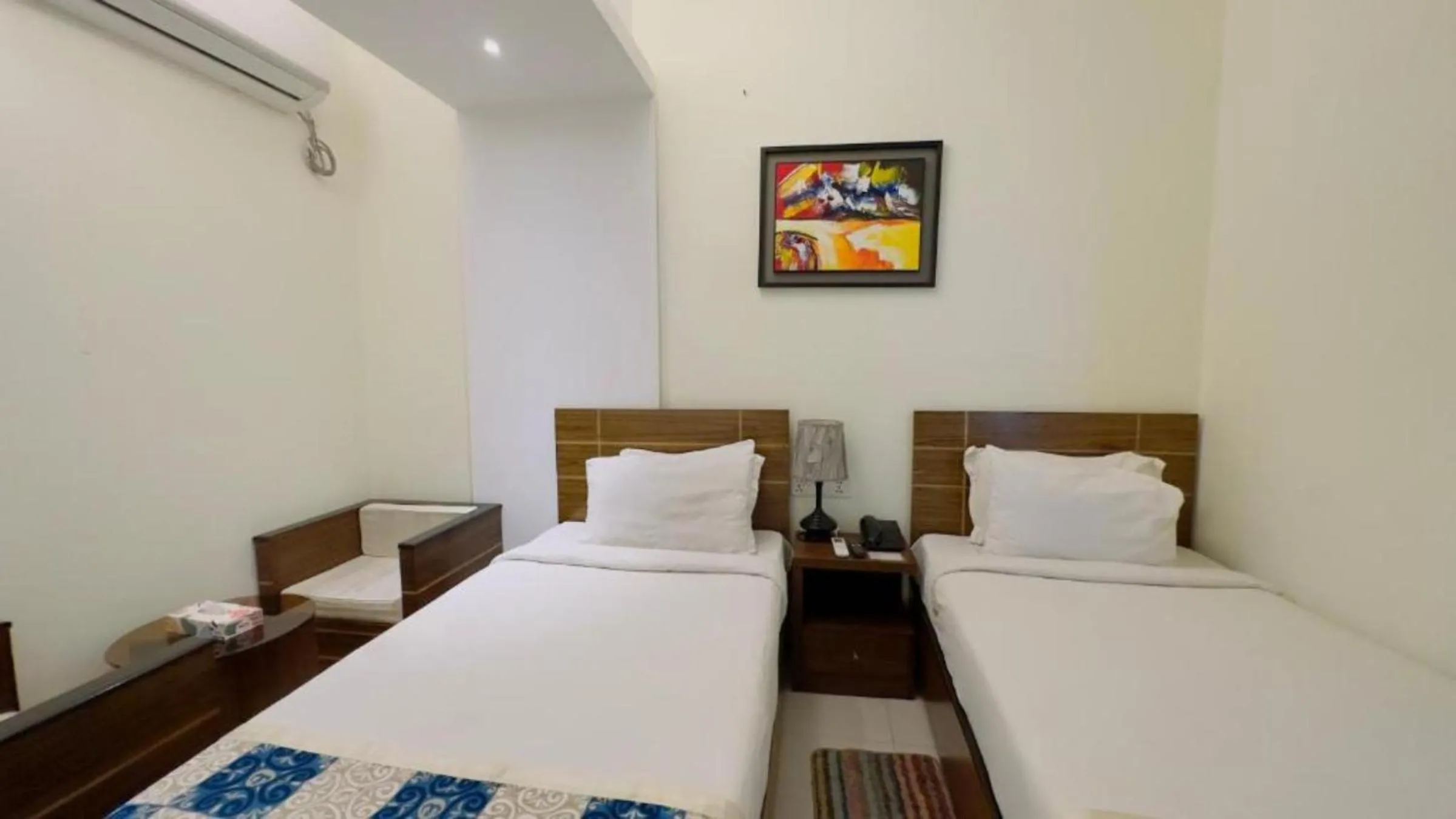 Bed in Royal Living Hotel & Suites