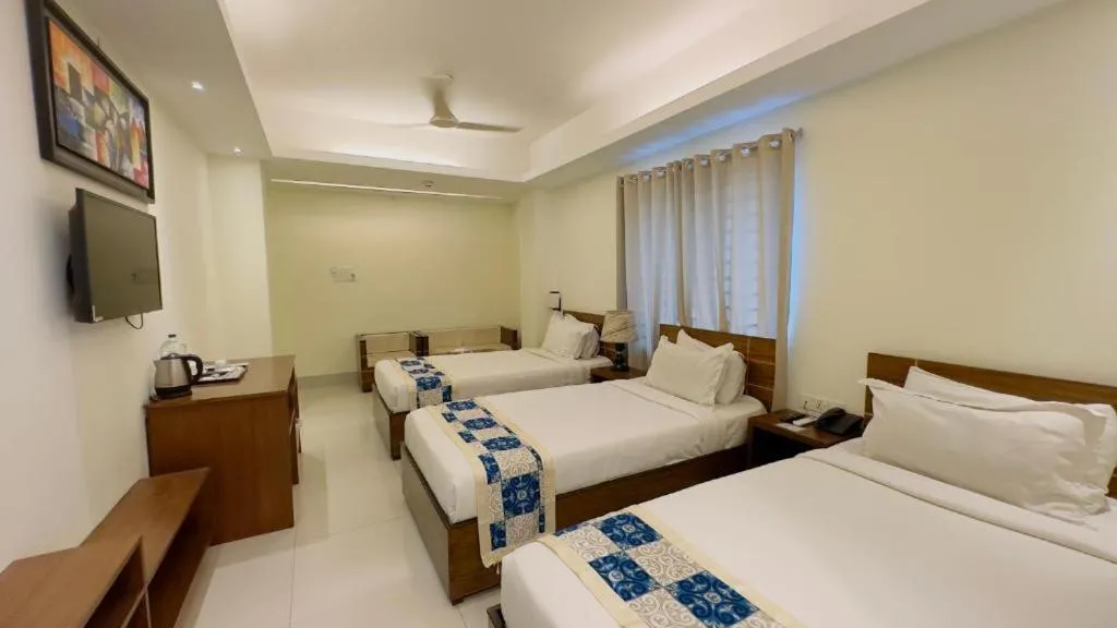 Bed in Royal Living Hotel & Suites