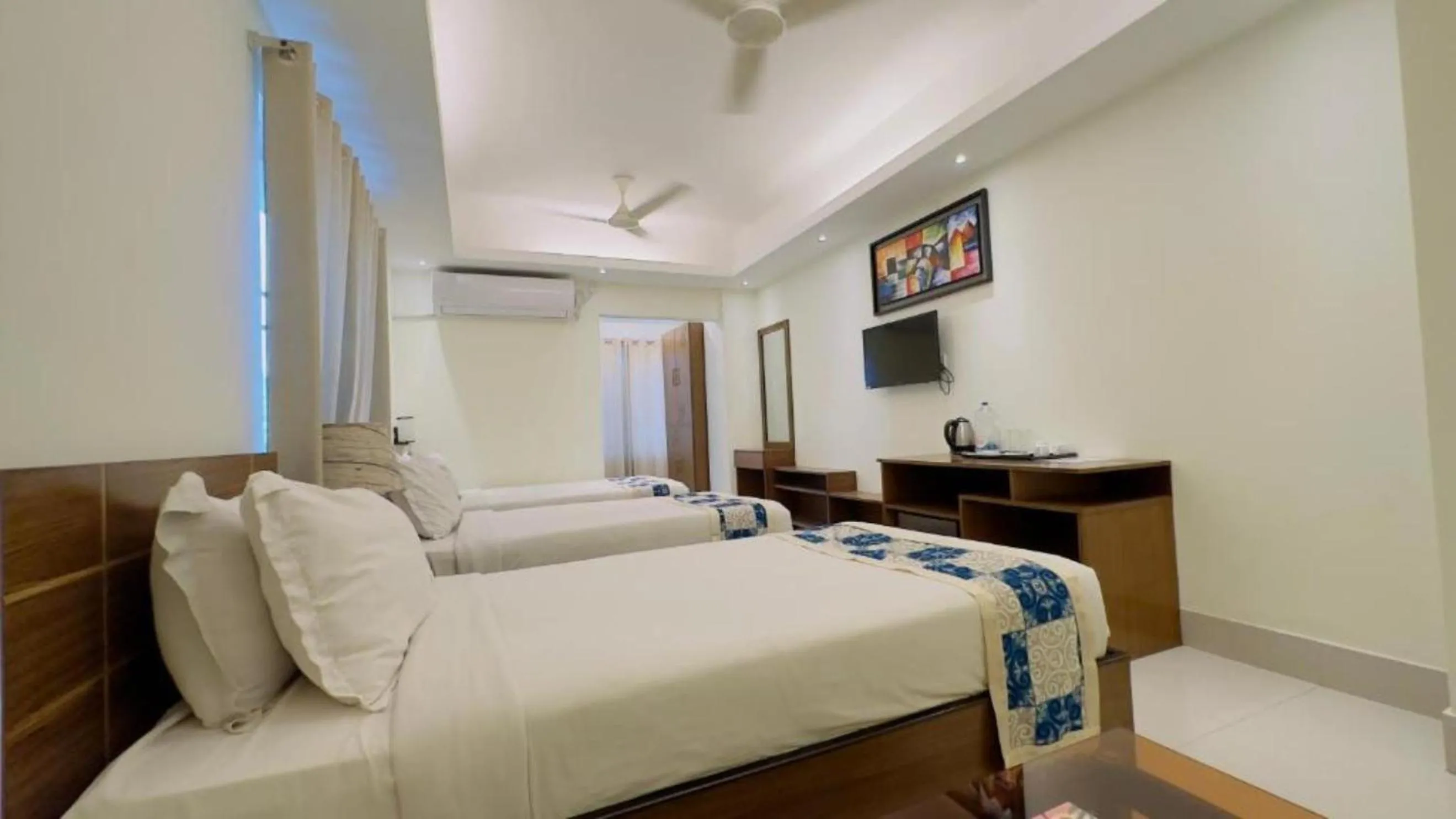 Bed in Royal Living Hotel & Suites