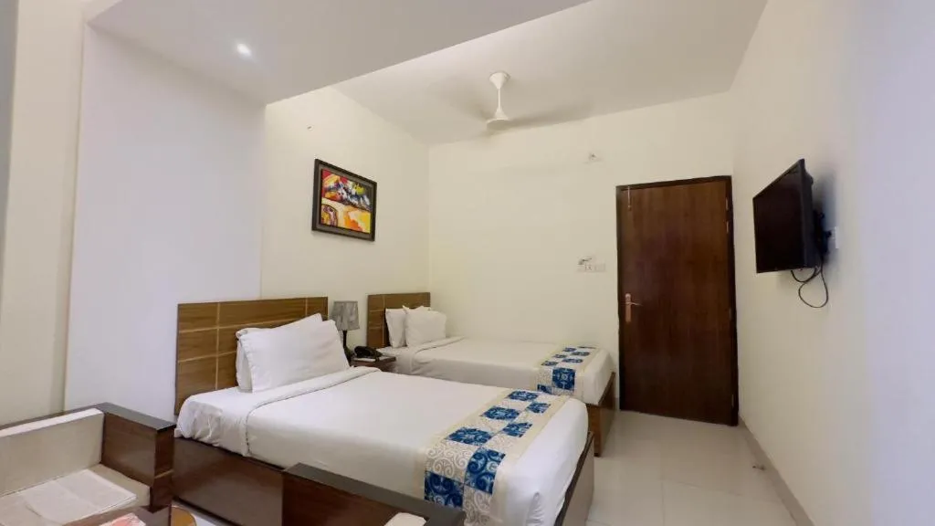 Bed in Royal Living Hotel & Suites