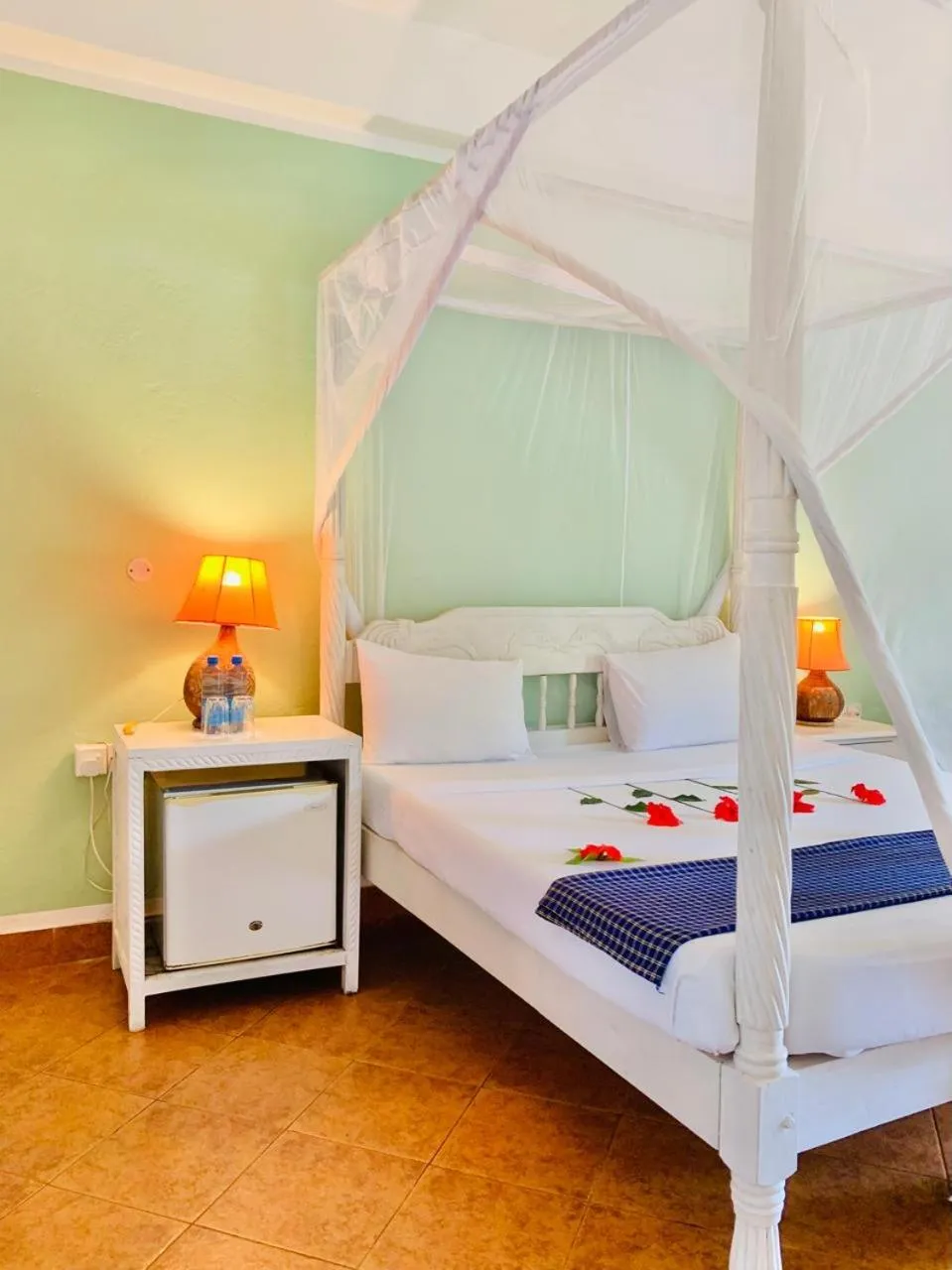 Bed in Lily Palm Resort