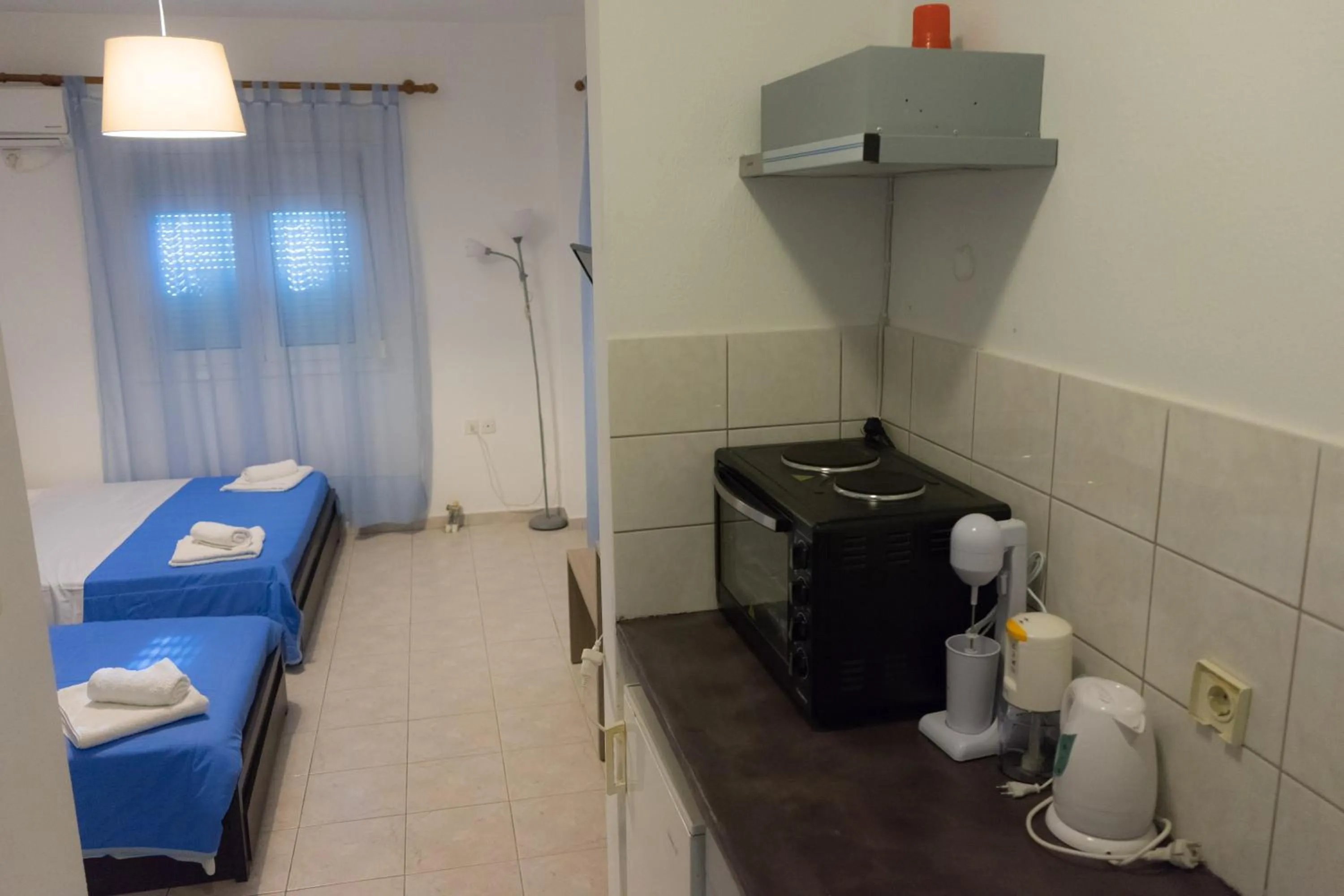 Bed in Polykratis Rooms