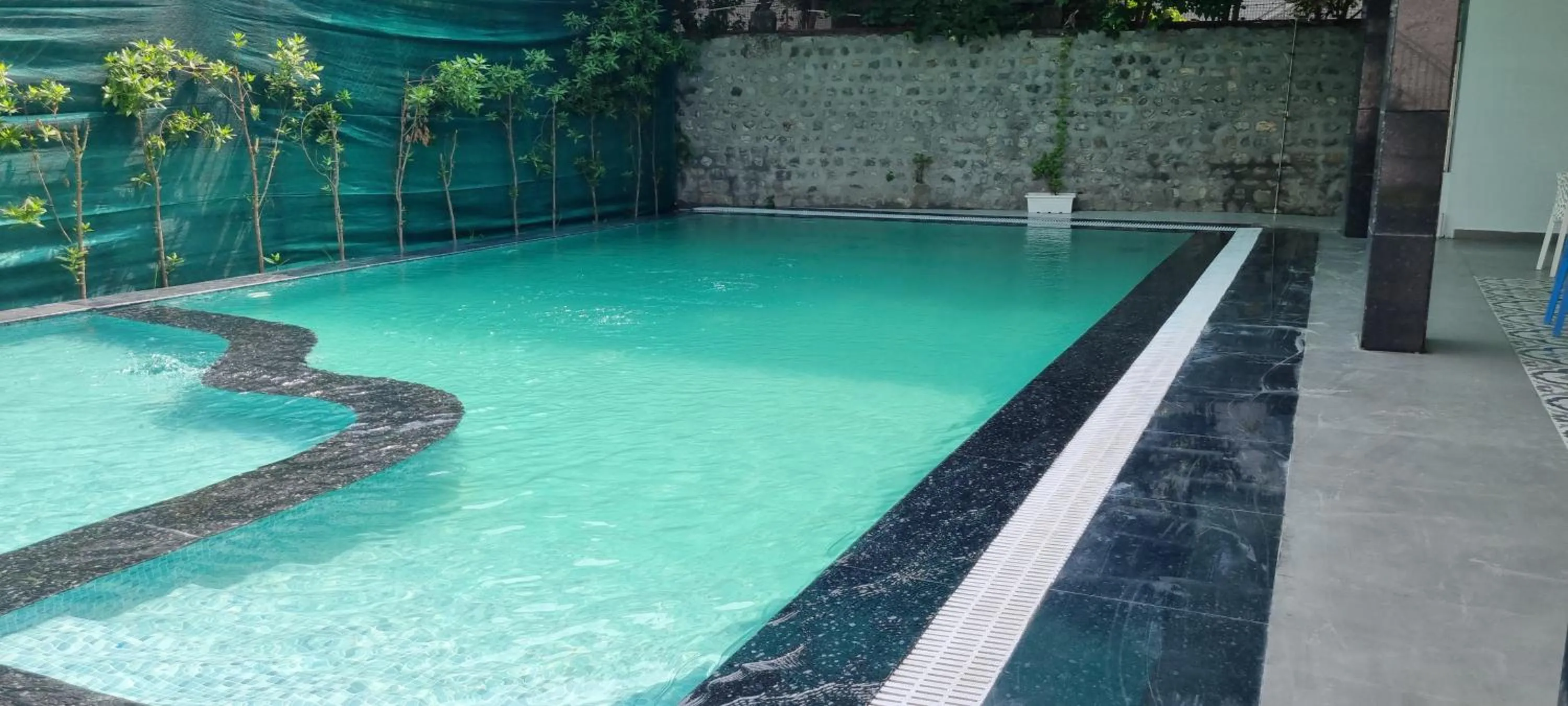 Swimming pool in Ravihans Aranyam - Resort & Restaurant