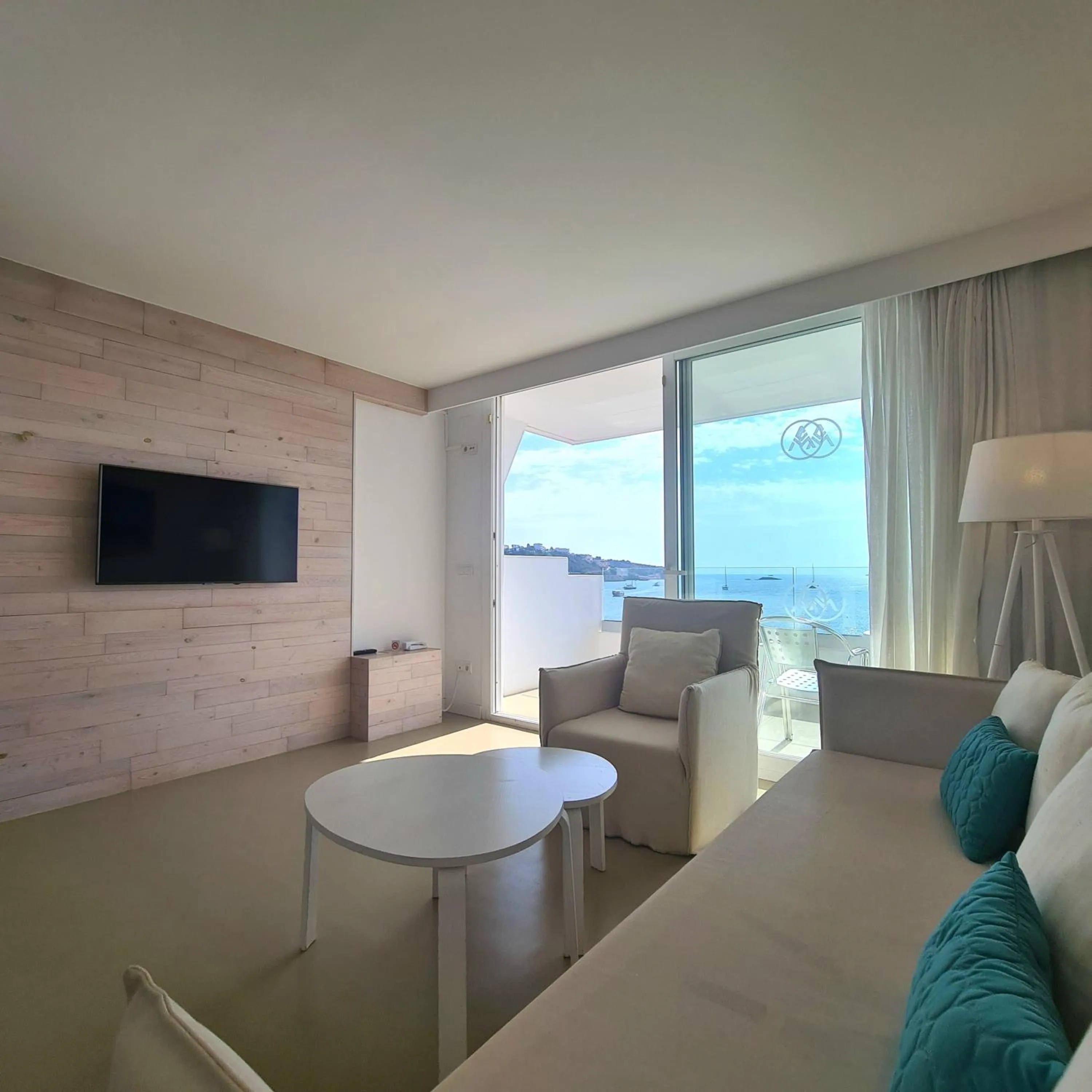 Communal lounge/ TV room in Apartamentos Llobet Ibiza