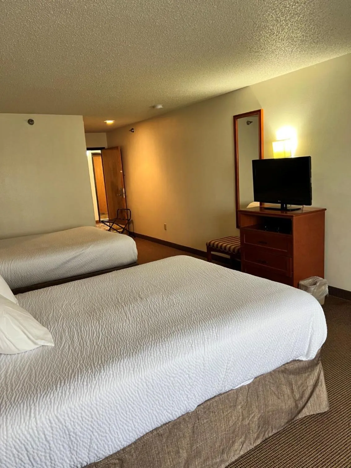 Bed in Serena Inn & Suites