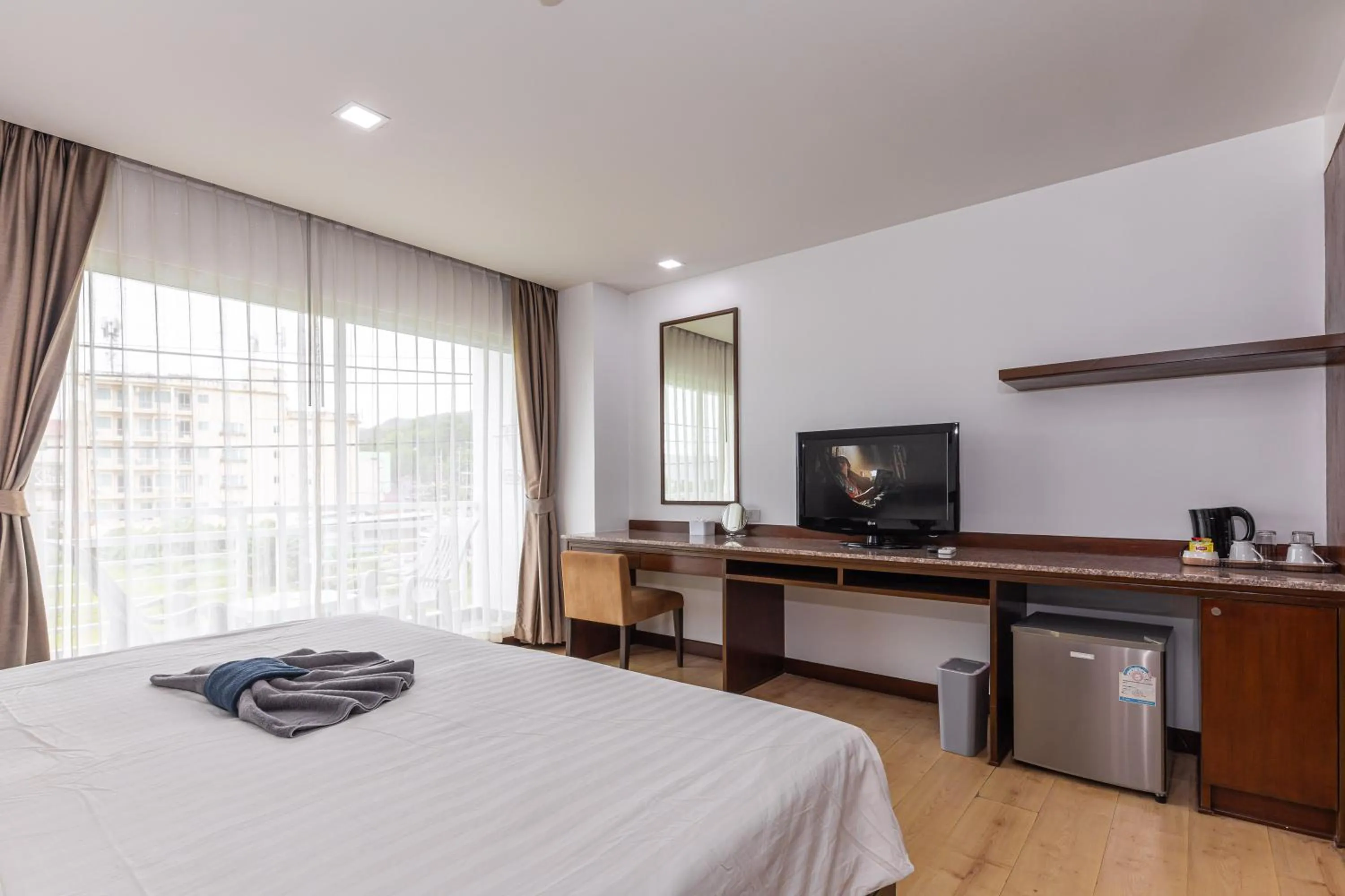 Bed in The Kris Resort Hotel