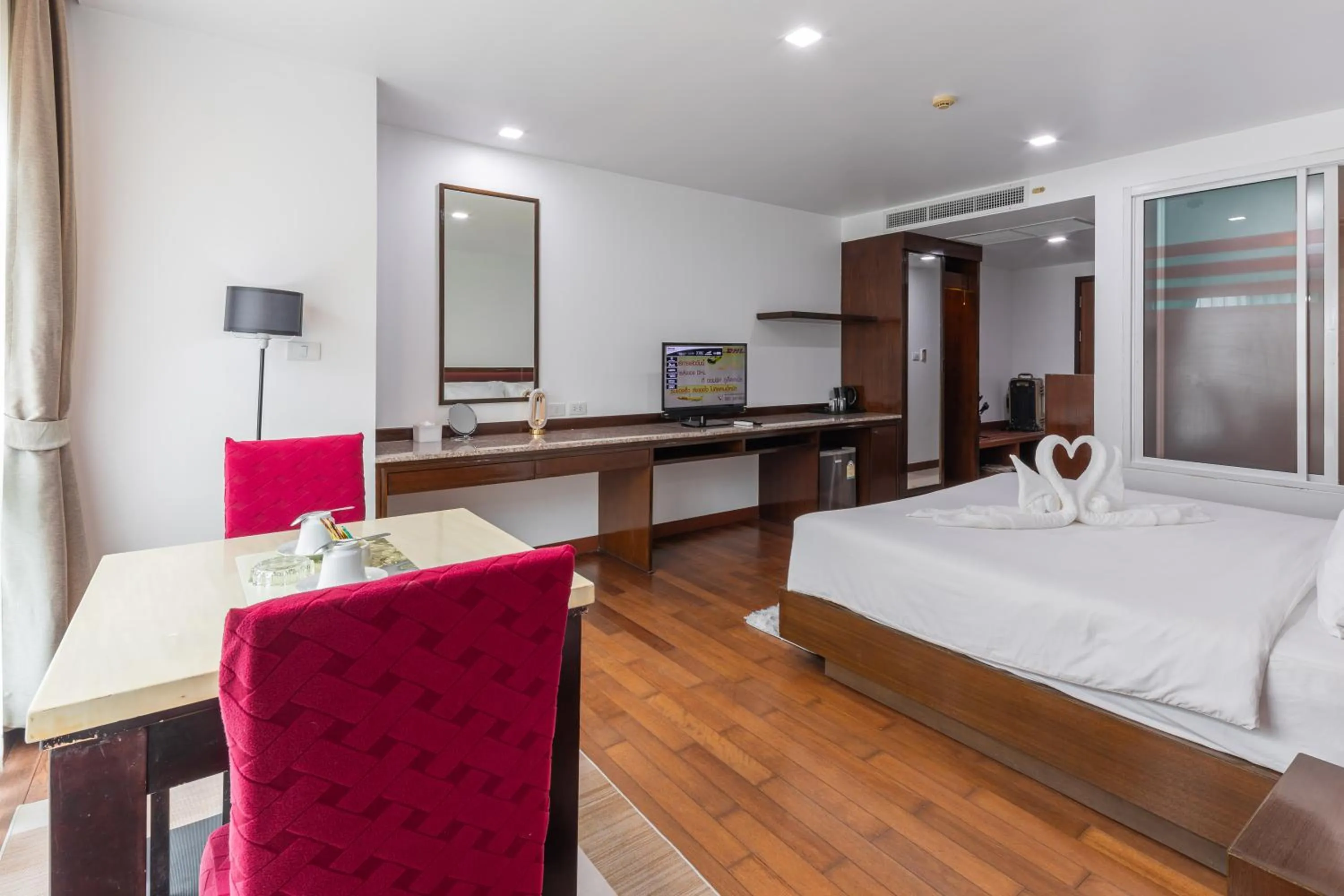 Bed in The Kris Resort Hotel