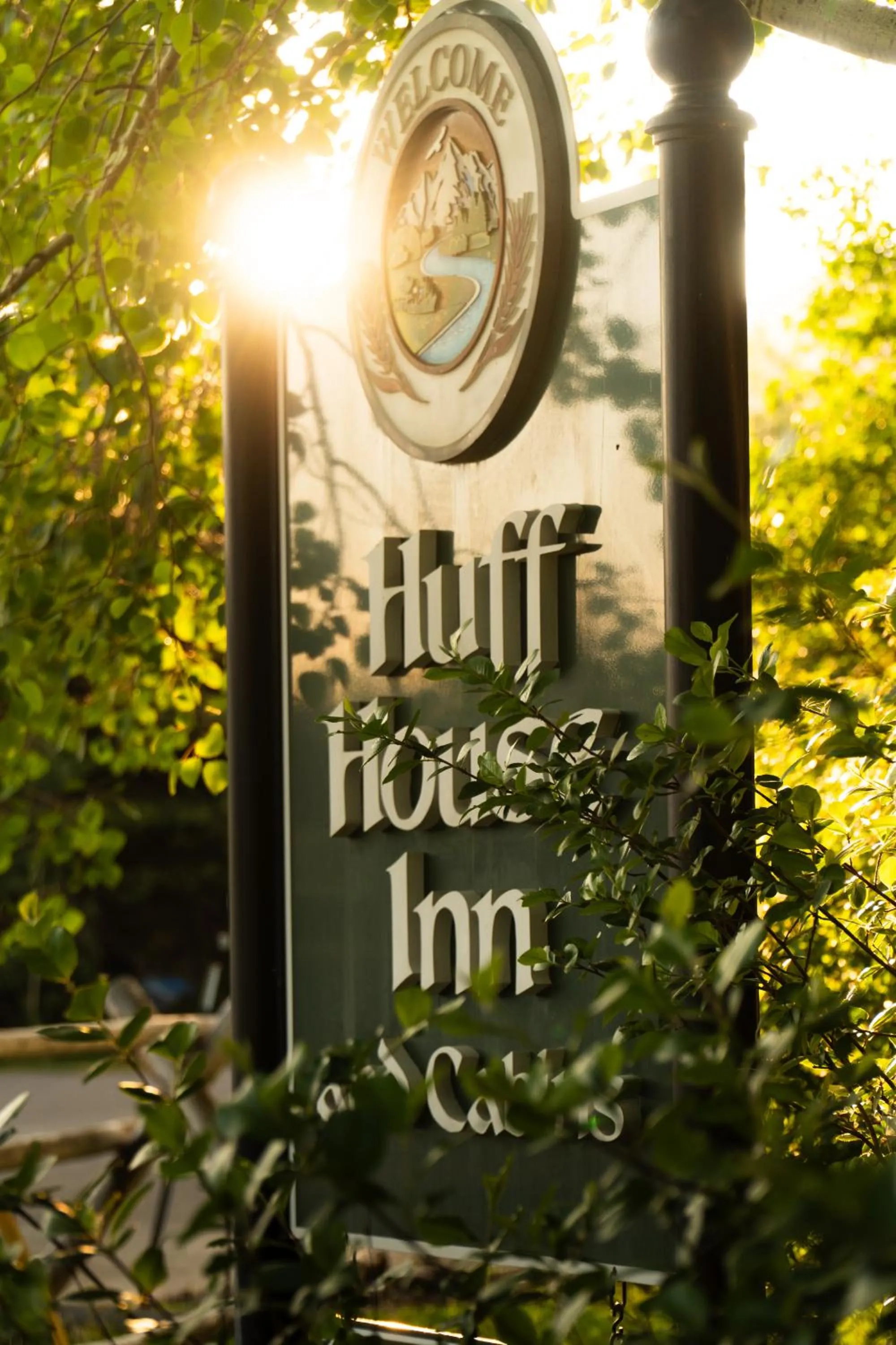 Property logo or sign in Huff House Inn and Cabins