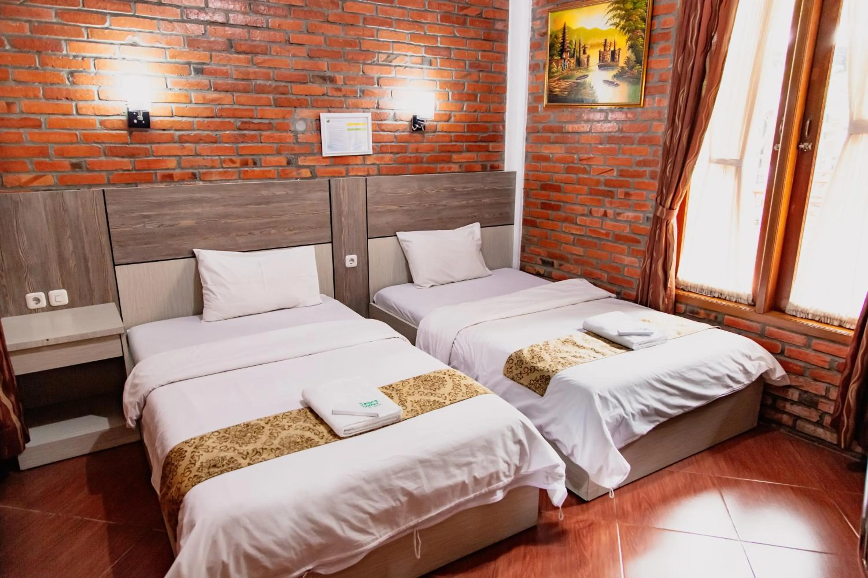 Bed in Saung Dolken Syariah Resort & Hotel
