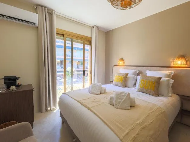 Photo of the whole room, Bed in Hôtel Lou Juan