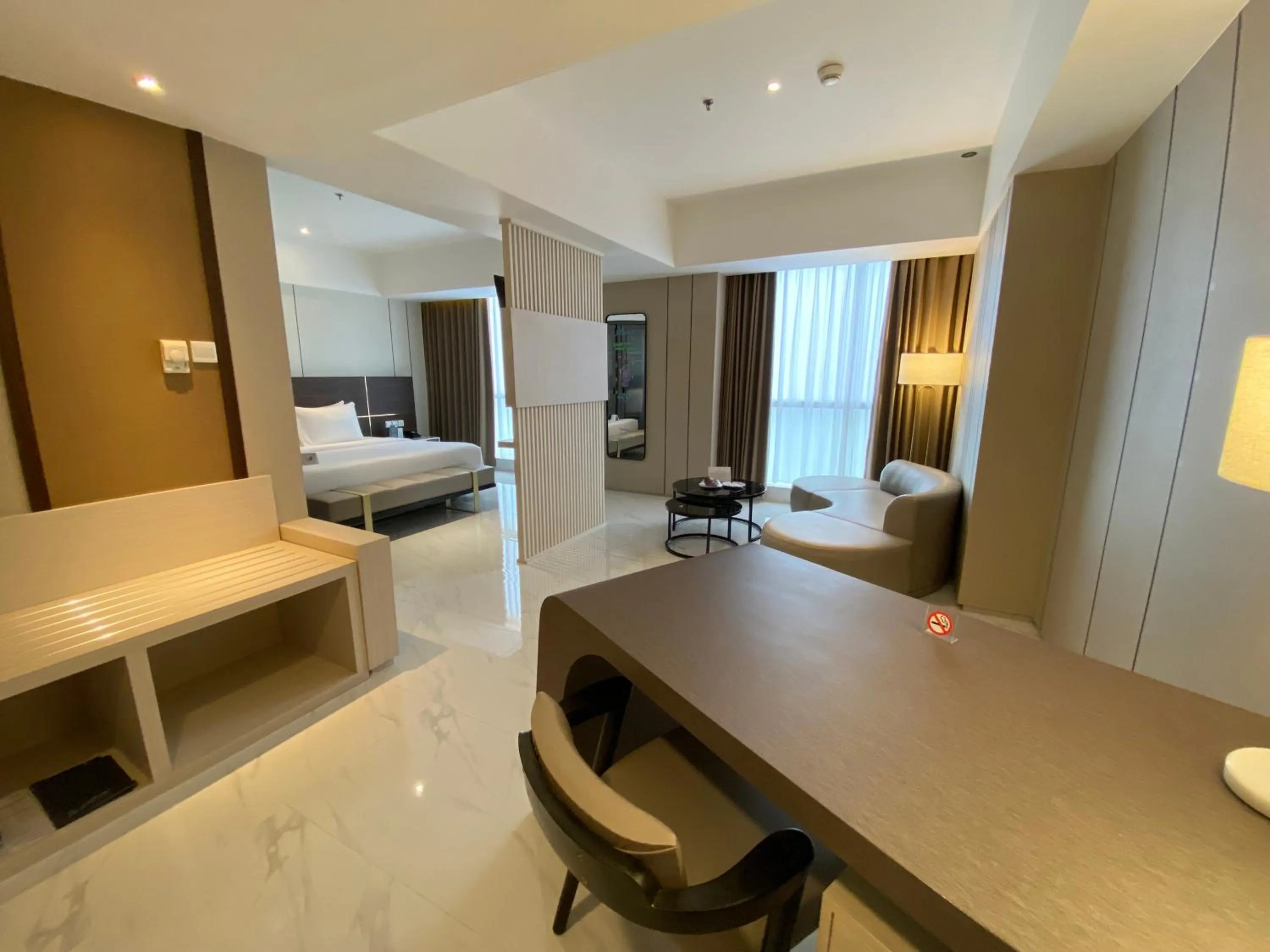 Living room, Bed in Grand Whiz Hotel Praxis Surabaya