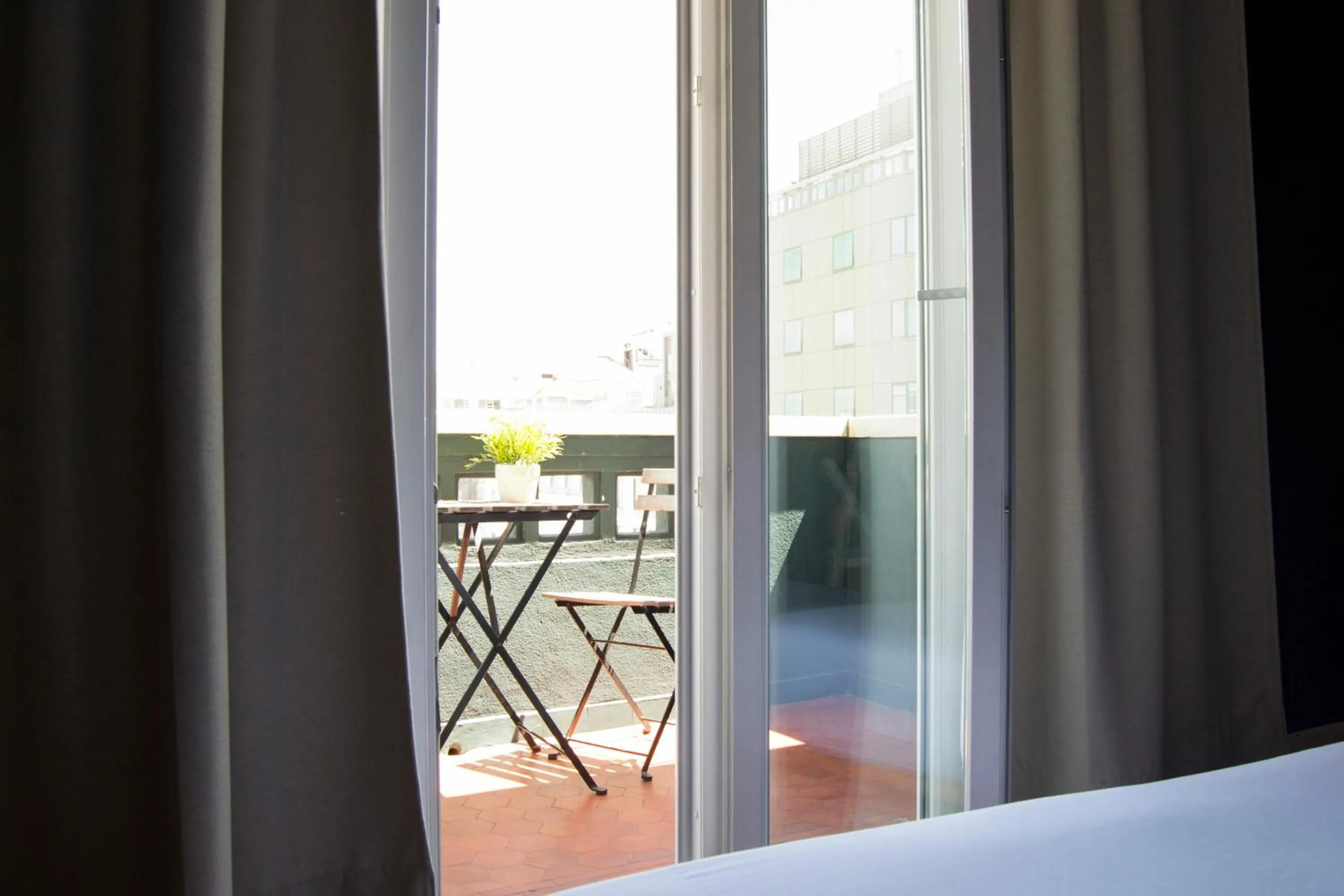 Balcony/Terrace, Bed in Avenue Hostel & Suites