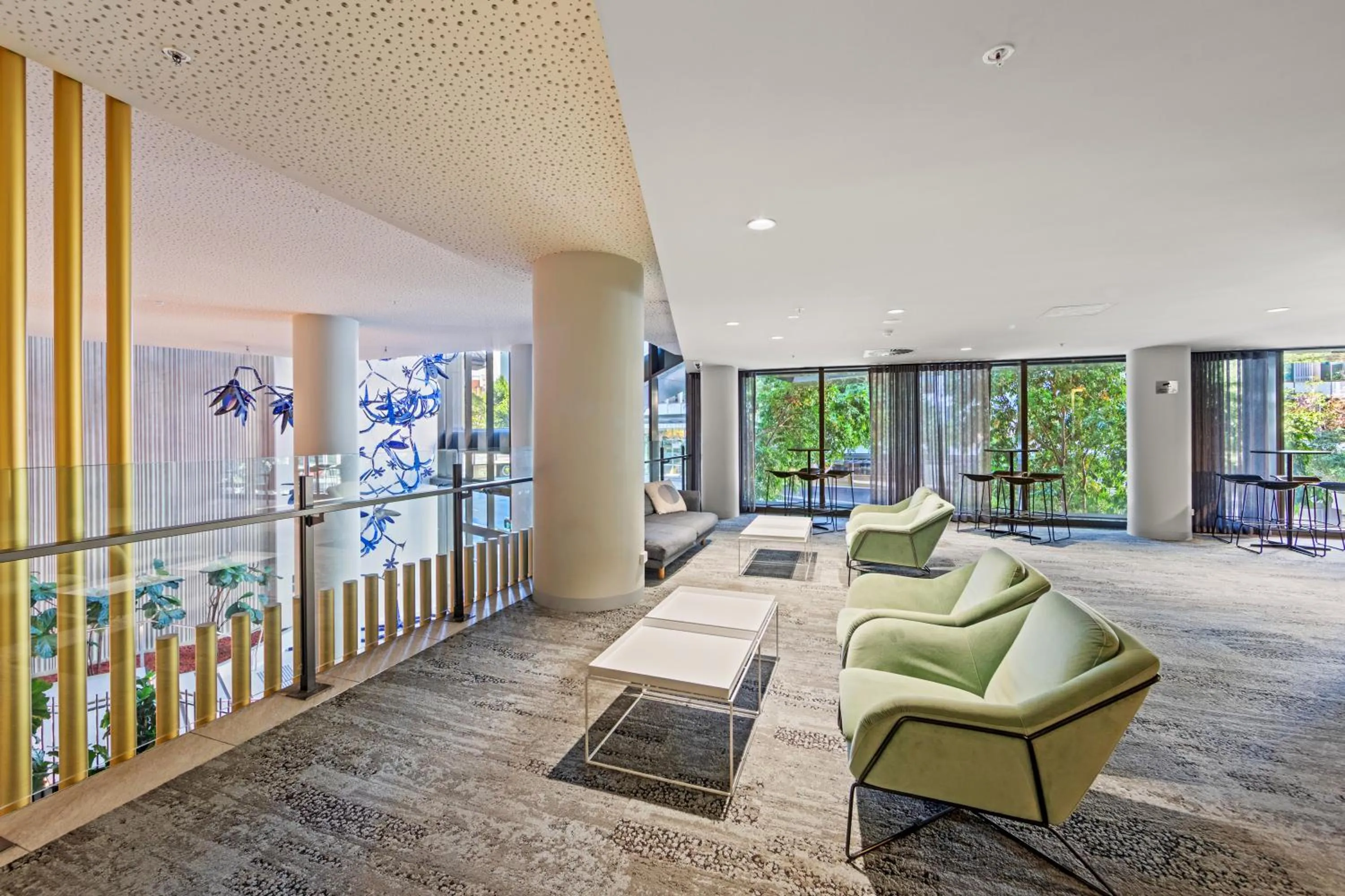 Seating area in Spire Residences by CLLIX