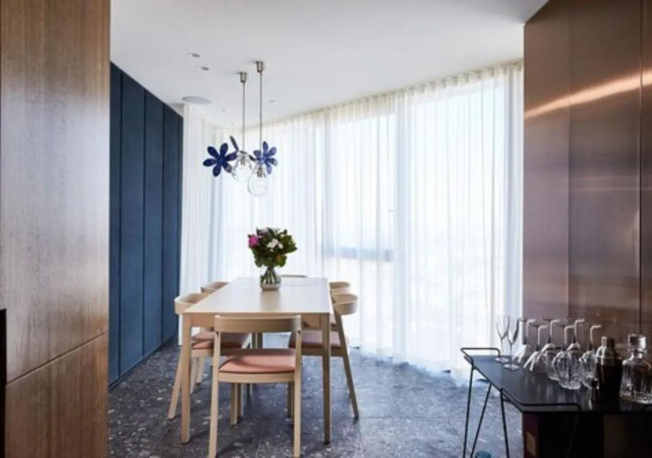 Dining area in Spire Residences by CLLIX