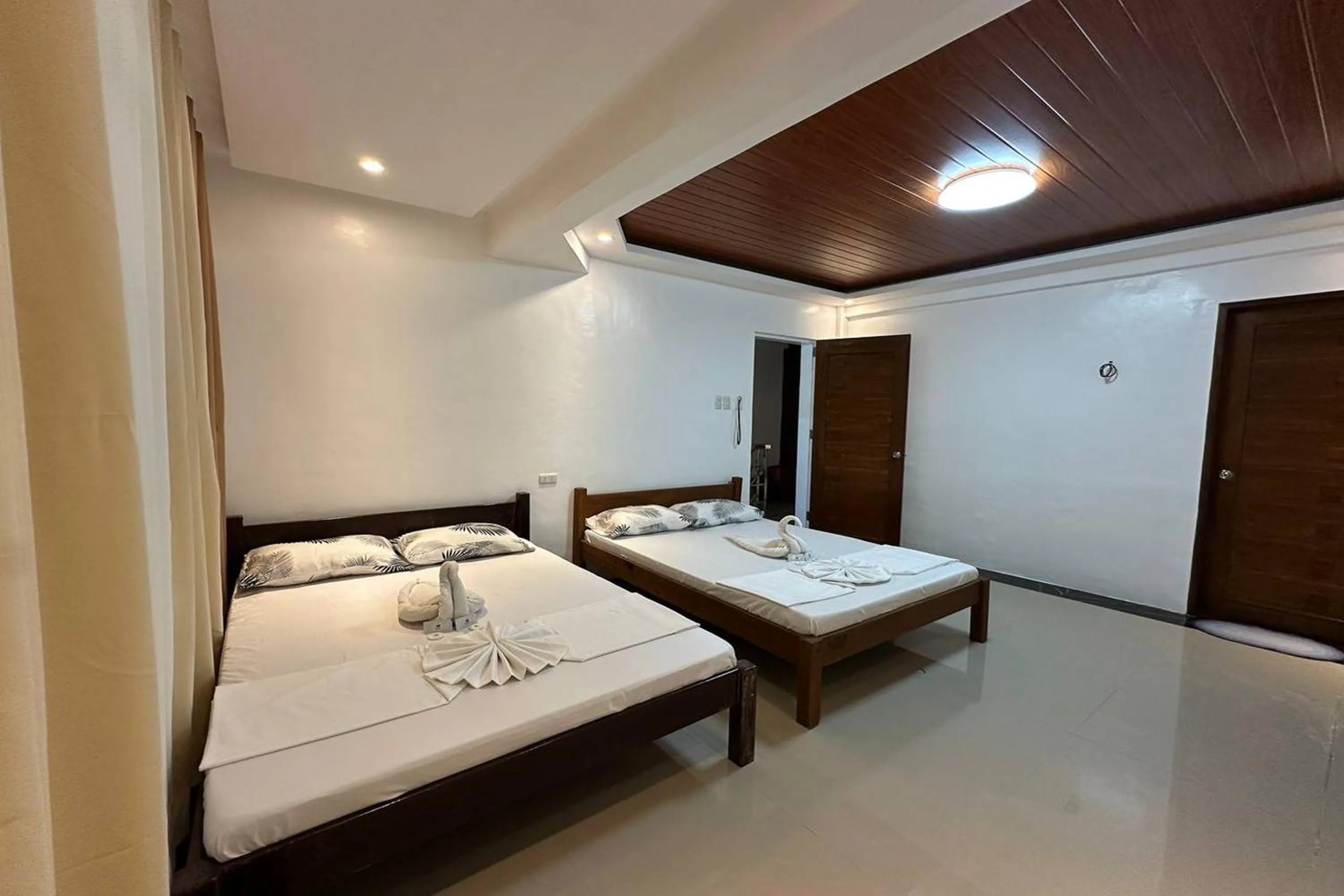 Bed in White-Beach Hideaway Resort Puerto Galera