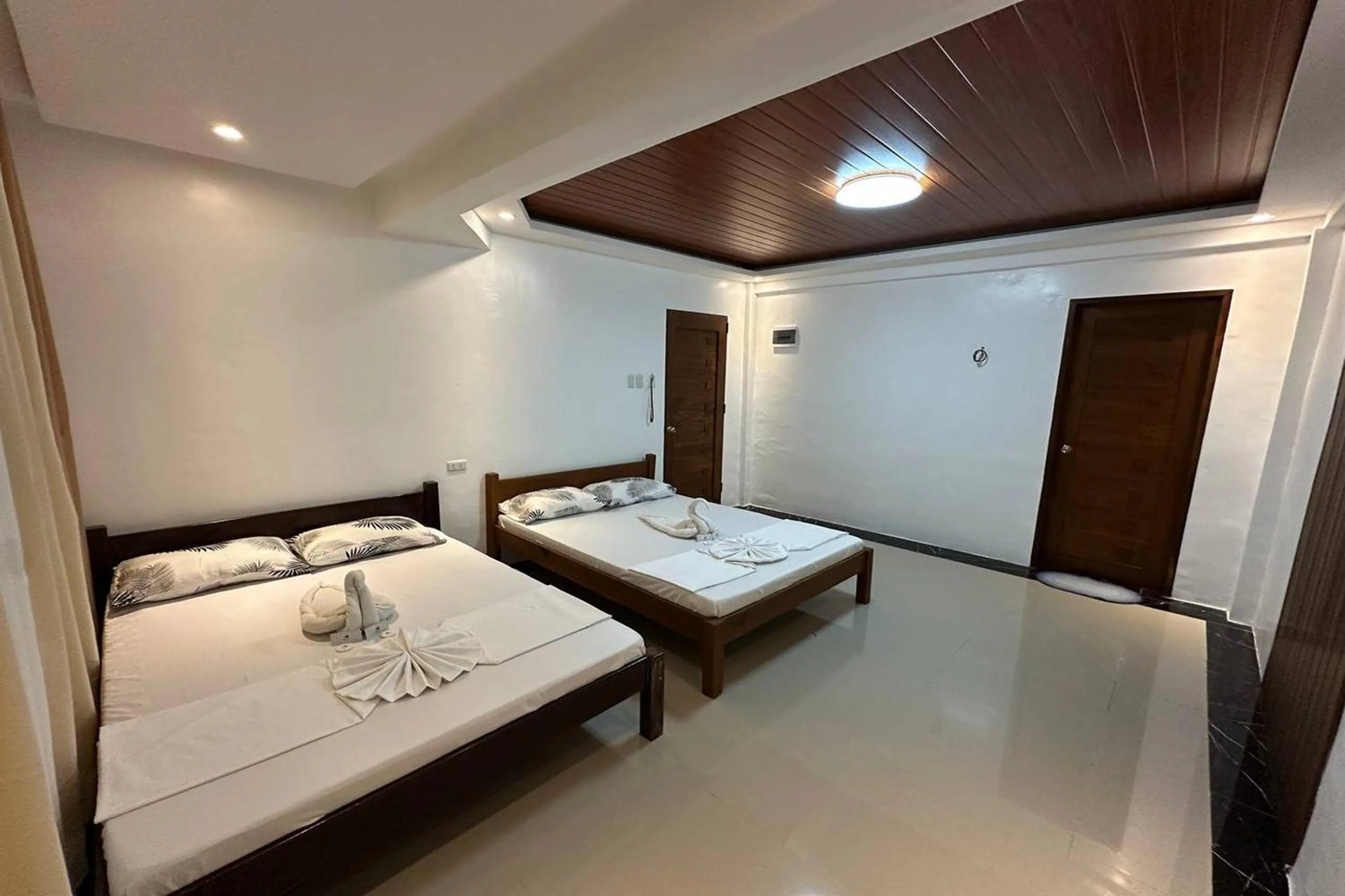 Bed in White-Beach Hideaway Resort Puerto Galera